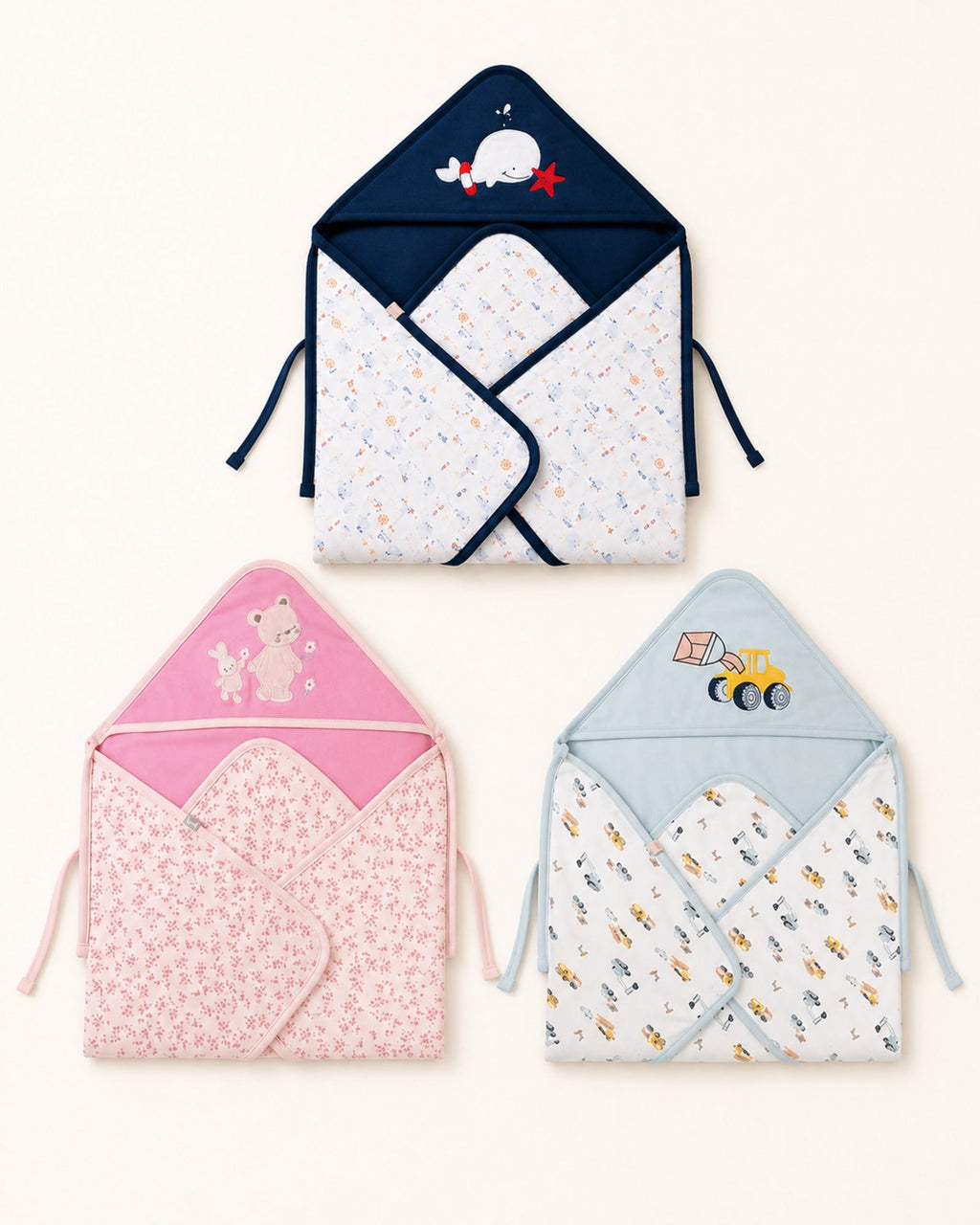 Printed hooded baby wrap in three designs — main product view