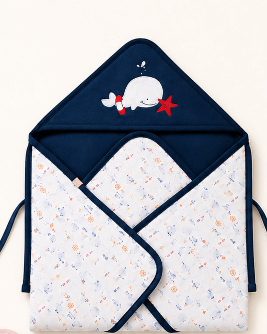Printed hooded baby wrap — Navy Whale design detail