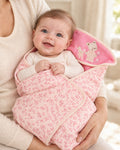 Funny Bunny pink hooded baby wrap, clothed baby held by mother