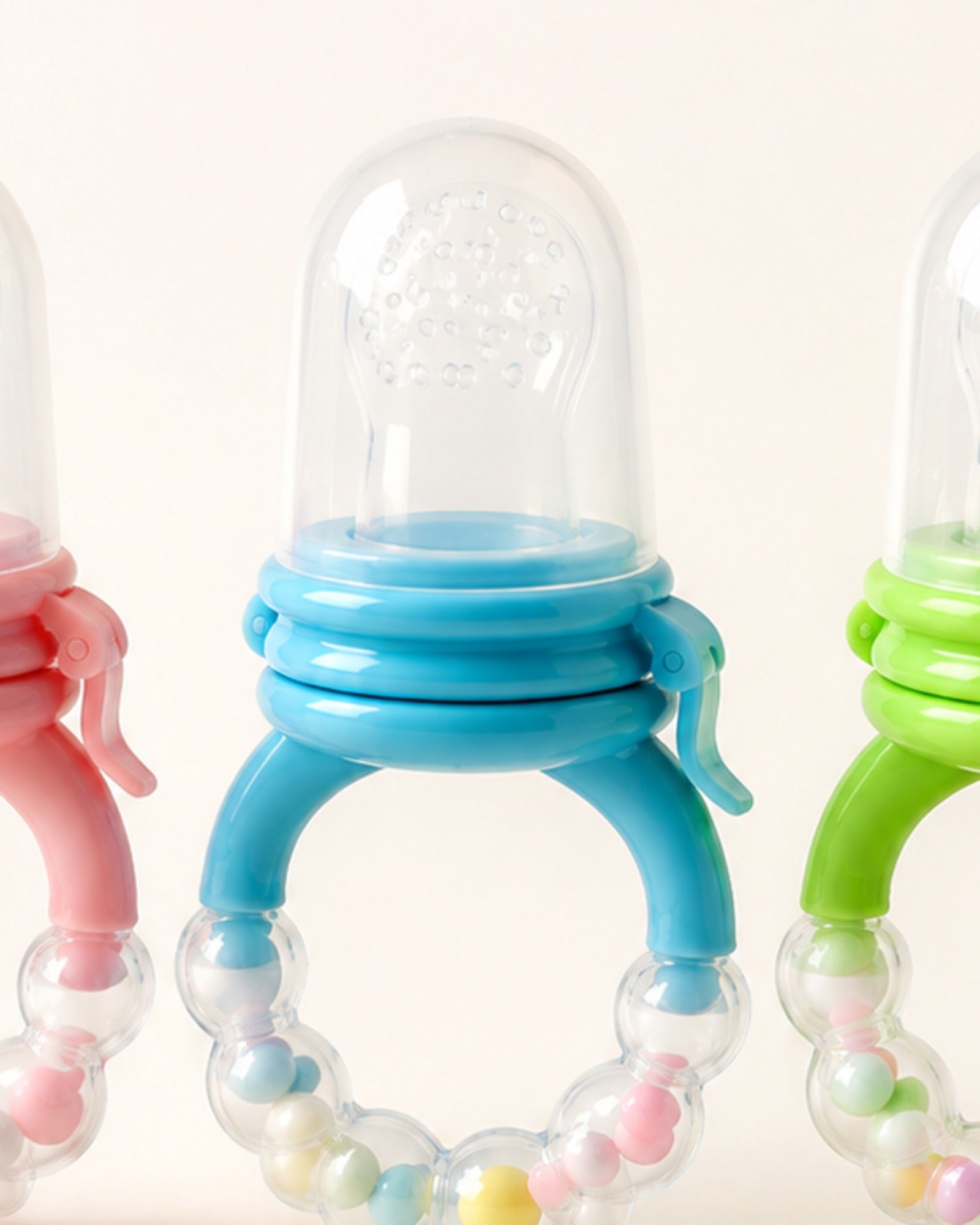 Fruit feeder teether — perforated bulb and ring detail