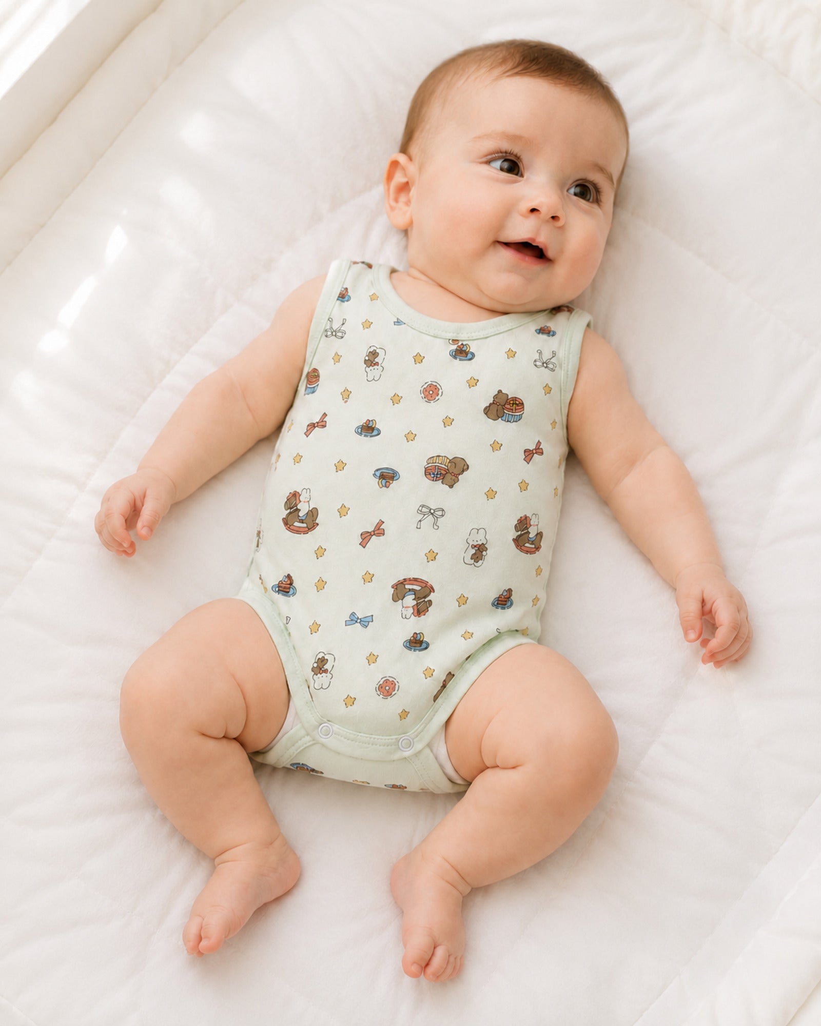 Baby wearing pale mint sleeveless bodysuit in a bright natural use-case setting