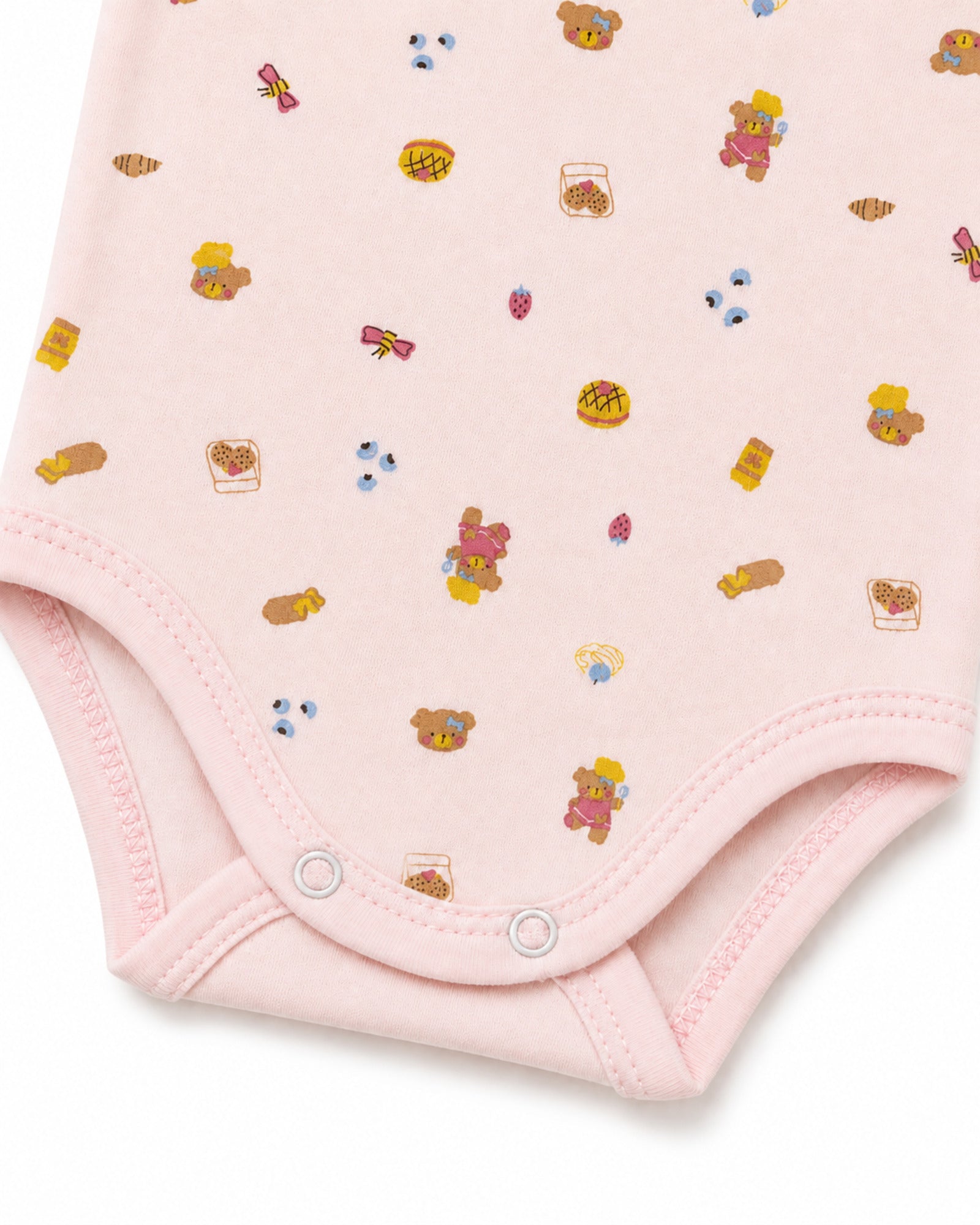 Pale pink baby bodysuit teddy bear and treats print, stitching and crotch snap detail on pure white background
