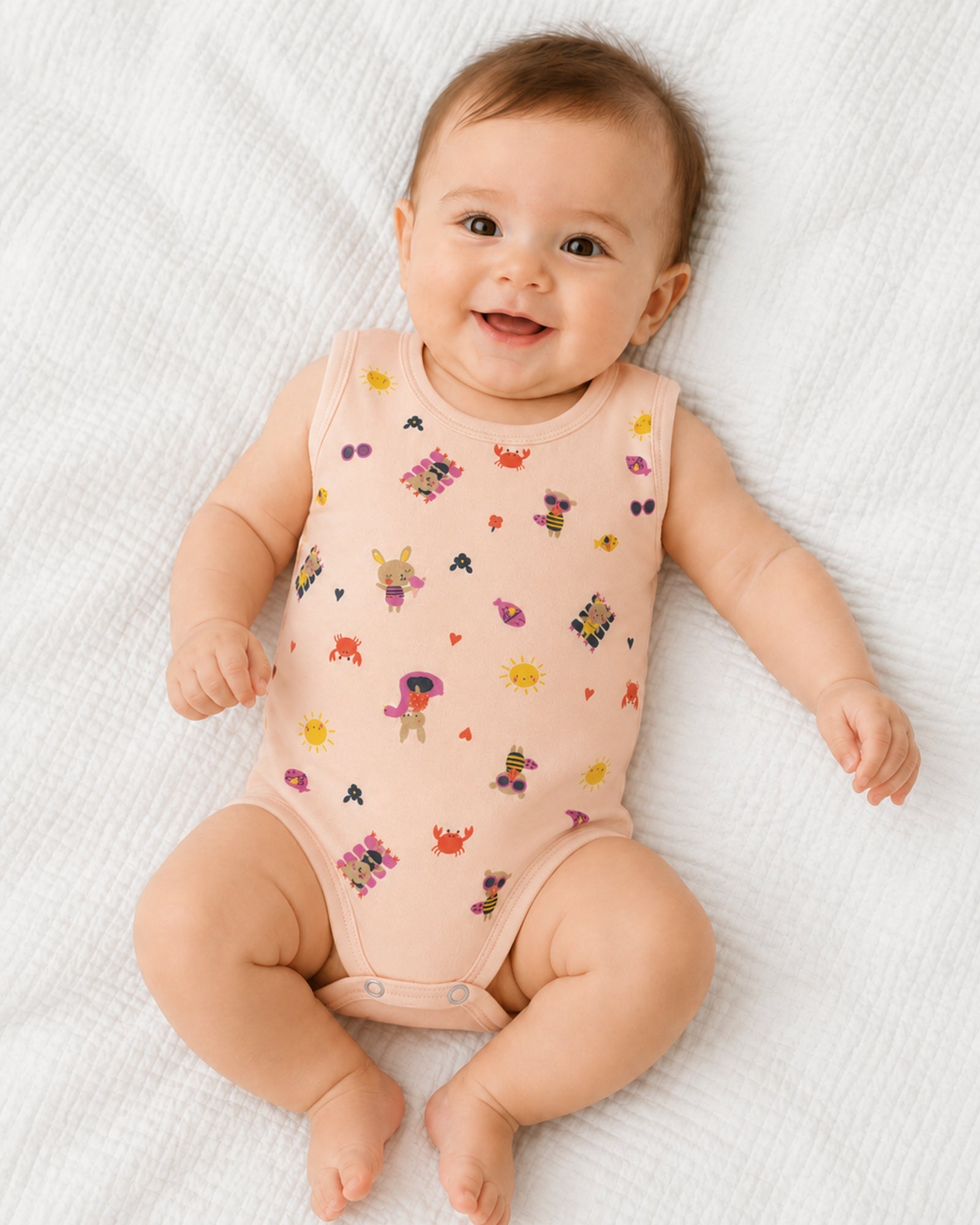 Baby wearing pale rose sleeveless bodysuit with playful seaside friends print