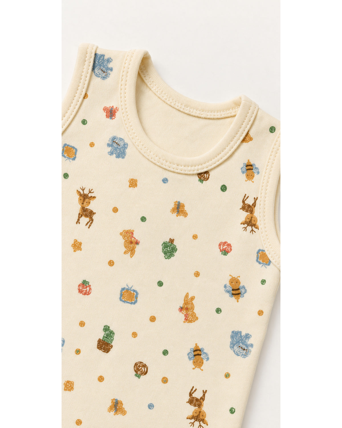 Cream woodland friends bodysuit neckline, fabric and armhole binding detail