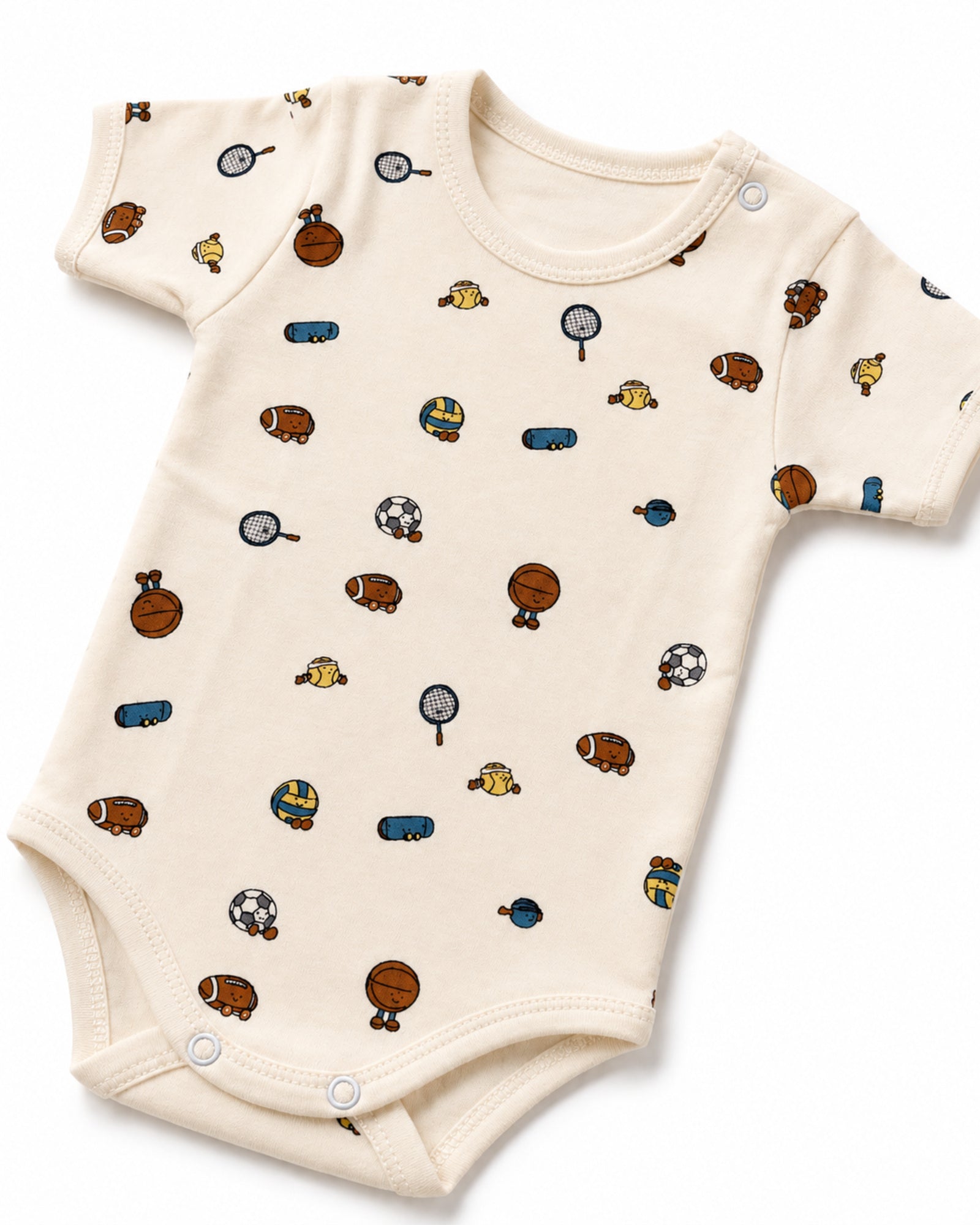 Cream baby bodysuit shoulder snap, sports print and stitching detail on white
