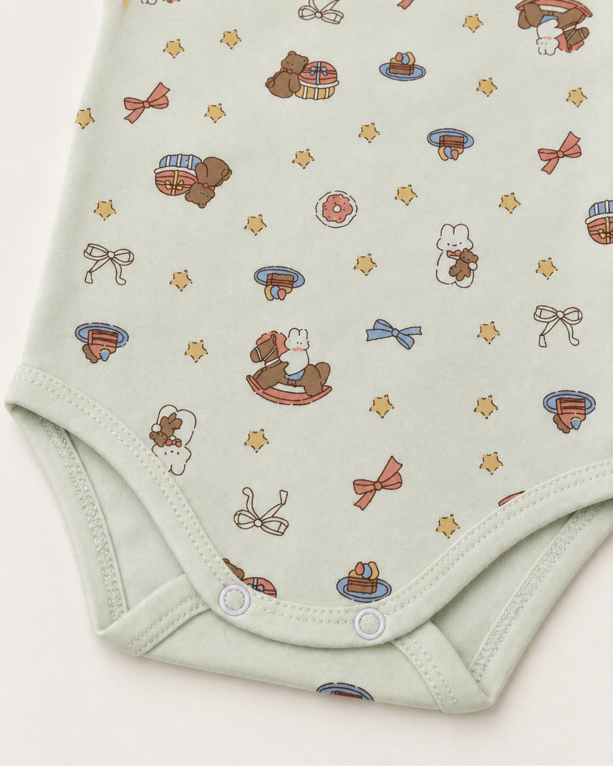 Pale mint rocking horse bodysuit leg binding and two bottom press snap detail
