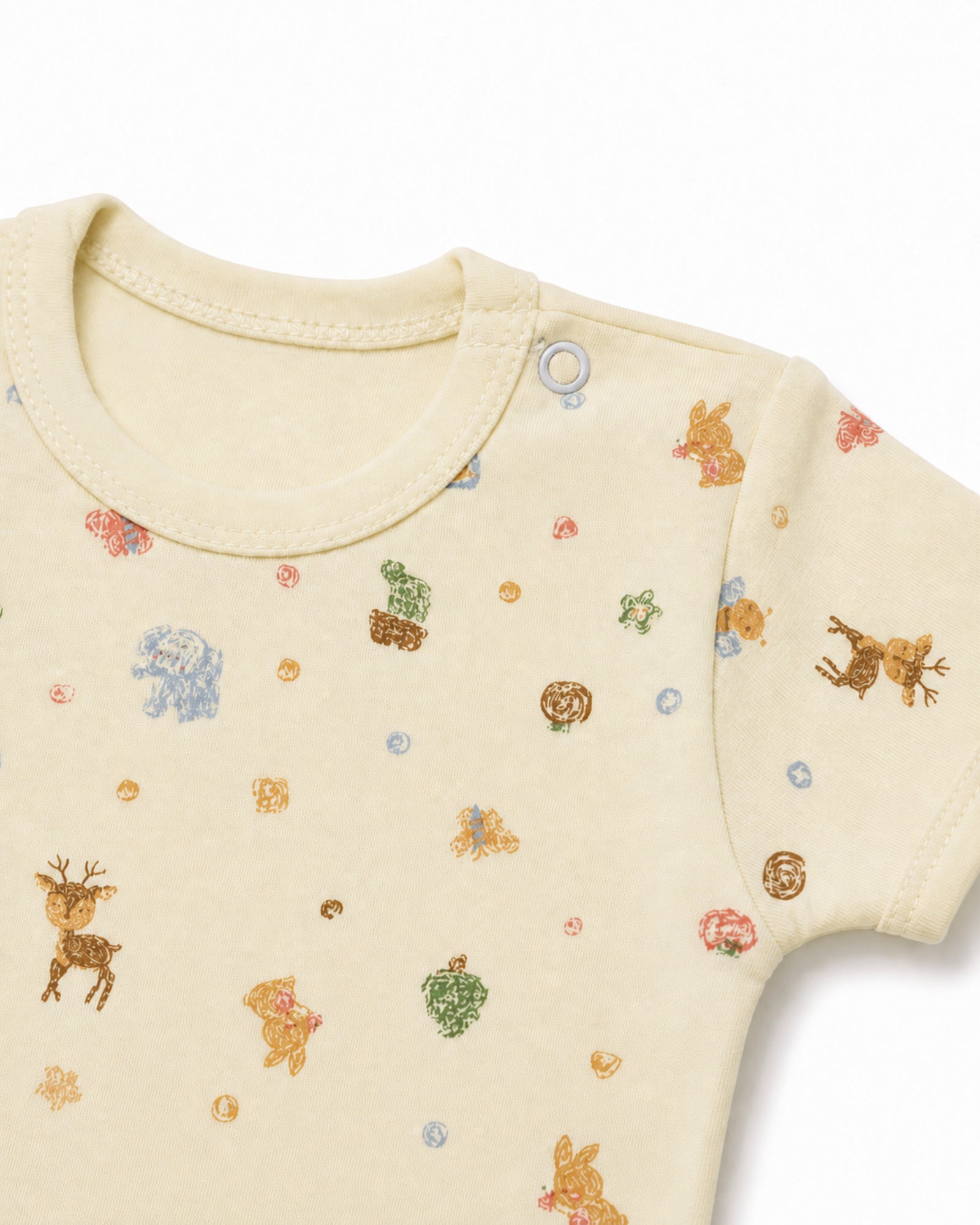 Pale yellow baby bodysuit neckline, shoulder snap, stitching and crayon print detail on white