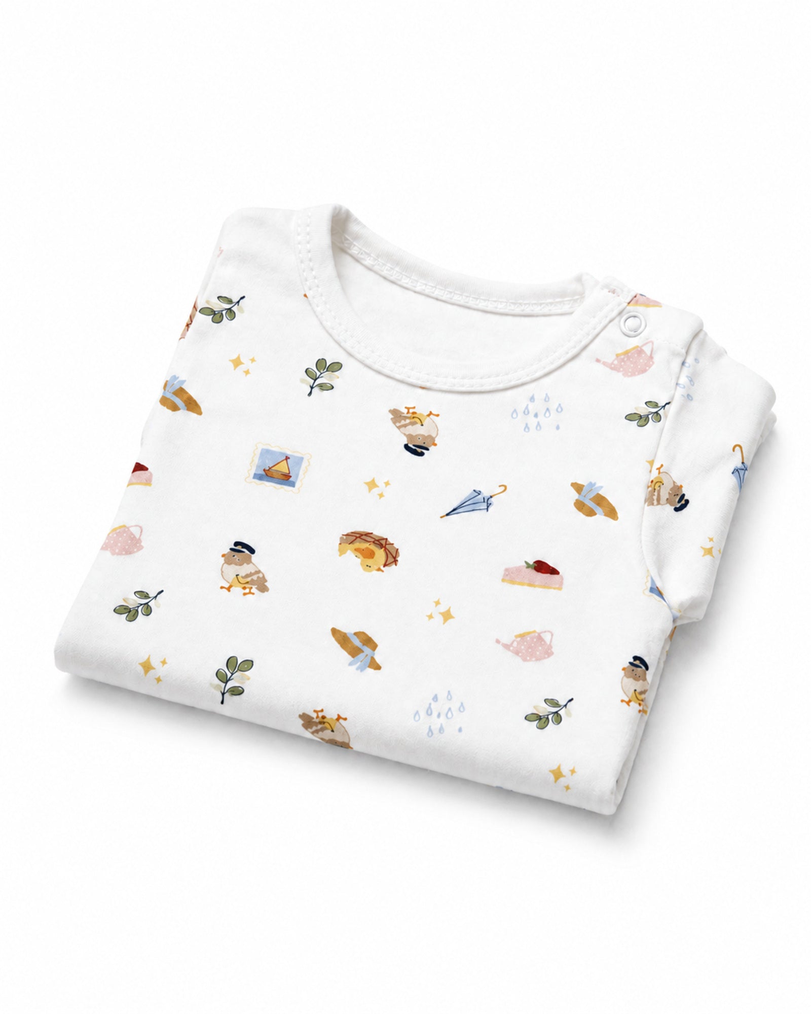 Folded white short-sleeve baby bodysuit with picnic and travel icons print on white