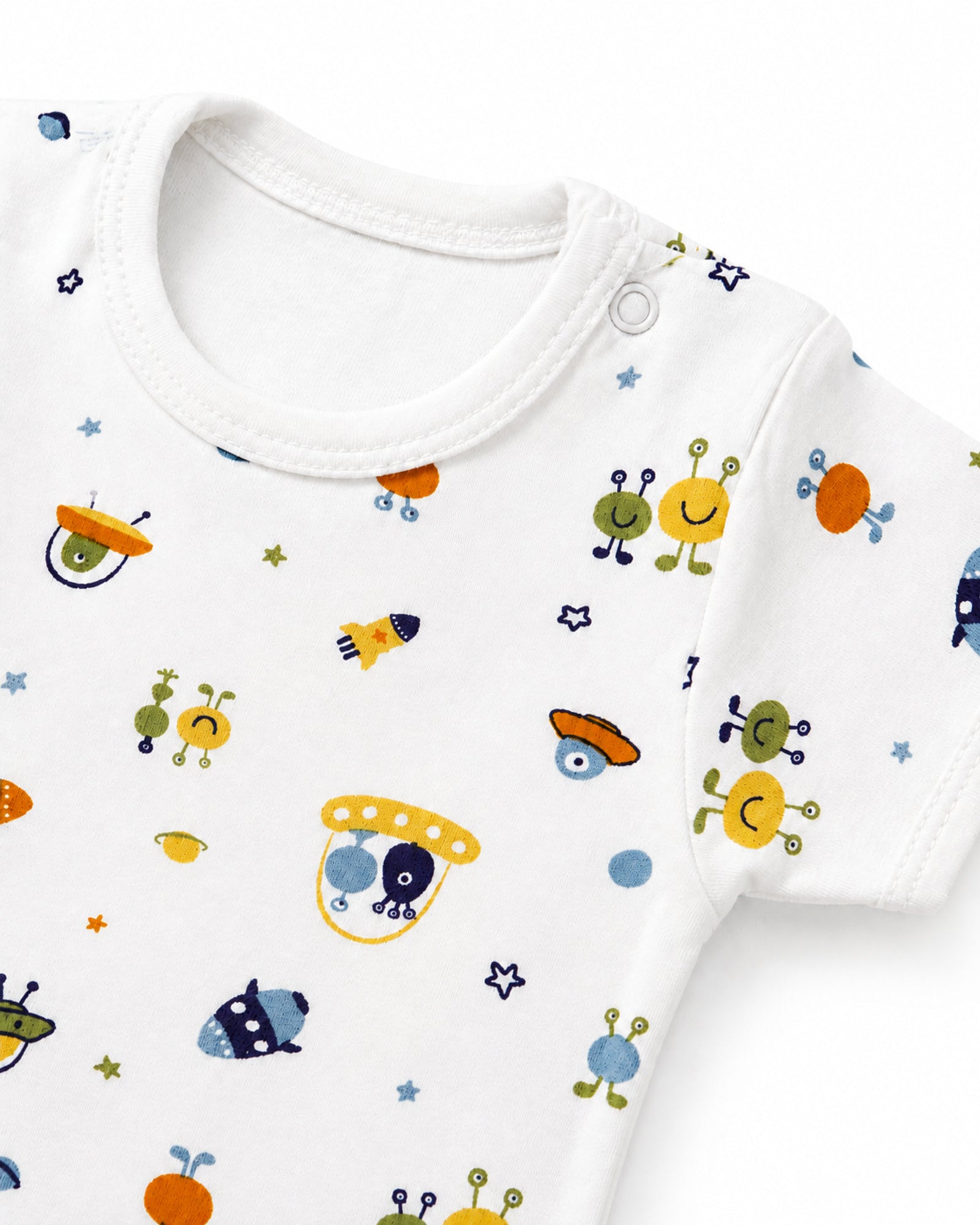 White rockets and space creatures print baby bodysuit neckline, shoulder snap and stitching detail on white