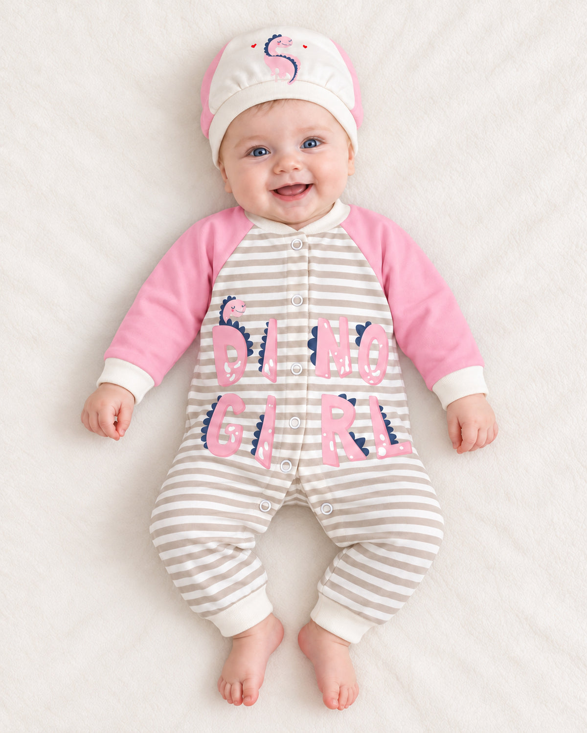 Baby Dream pink dinosaur sleepsuit and hat set, baby wearing the complete outfit