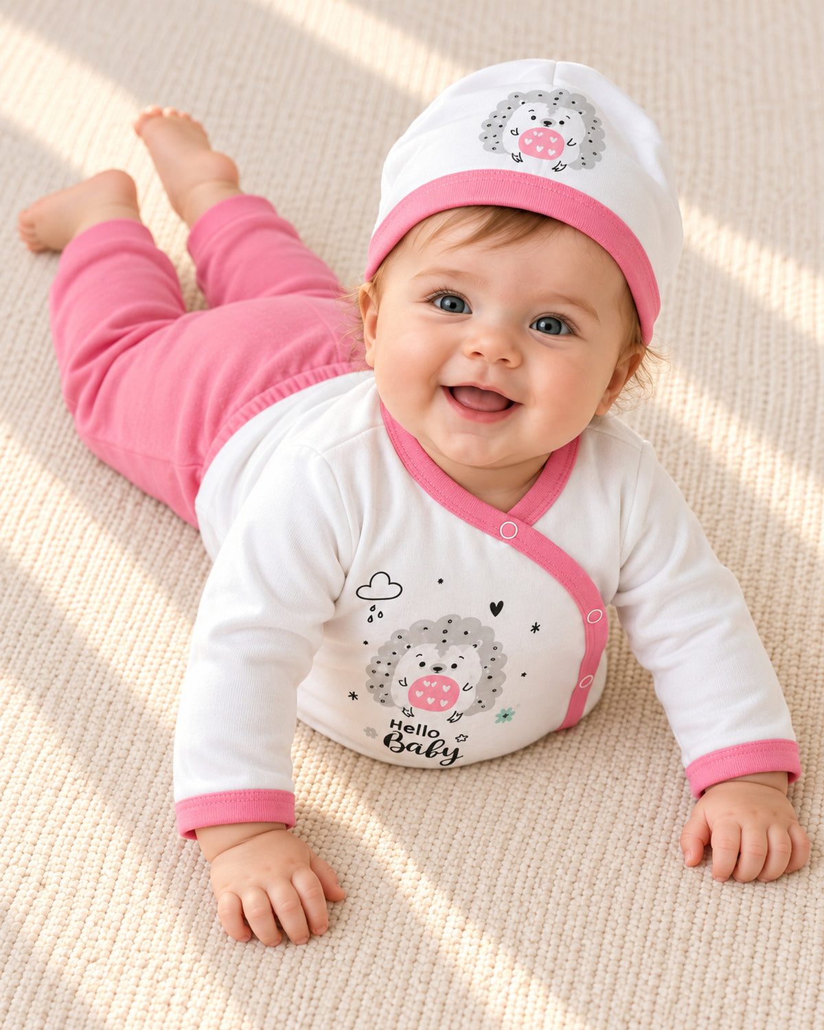 Baby Dream pink hedgehog baby set, baby wearing the set during awake floor play