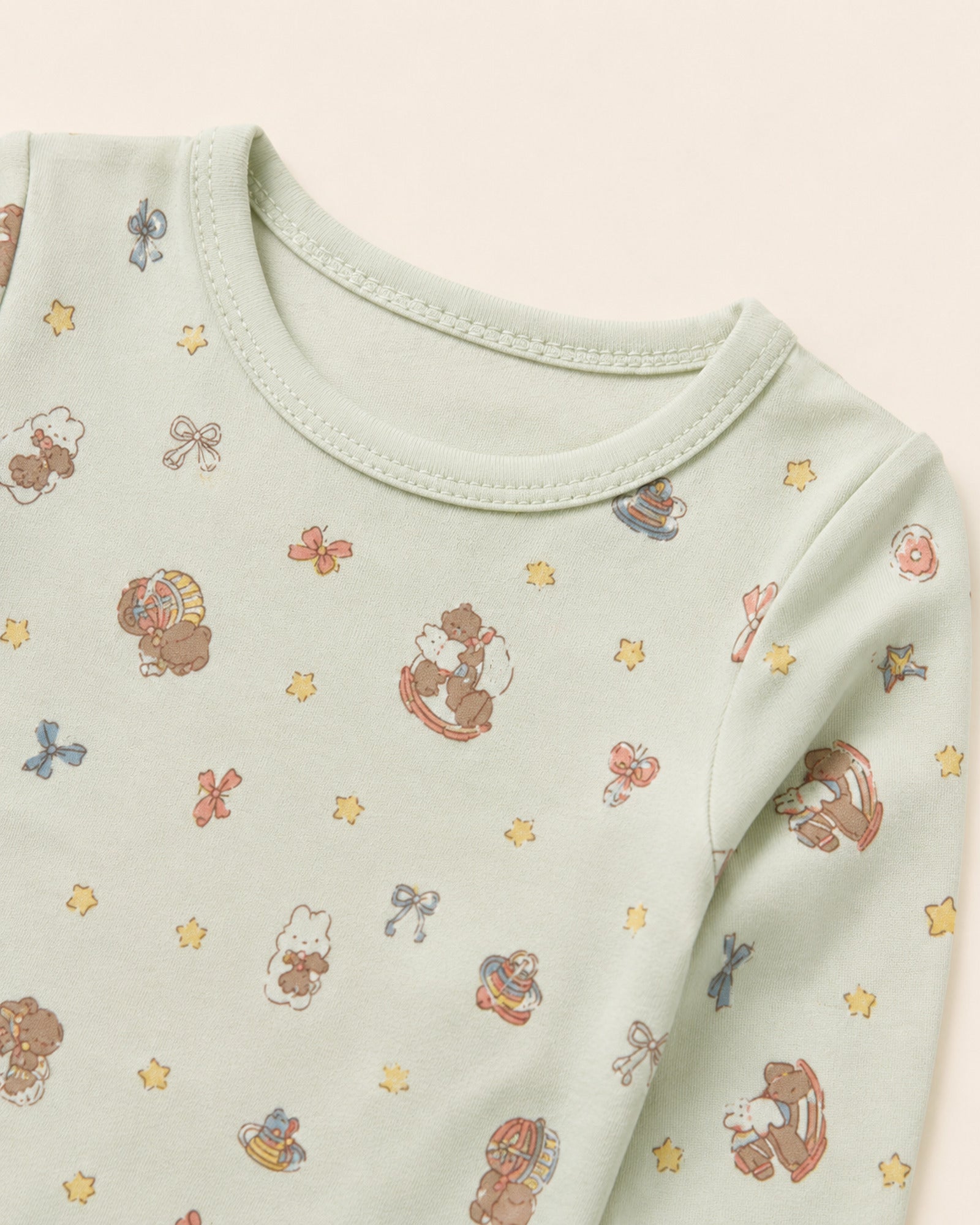 Pale mint baby set neckline, stitching and teddy bear rocking horse print detail