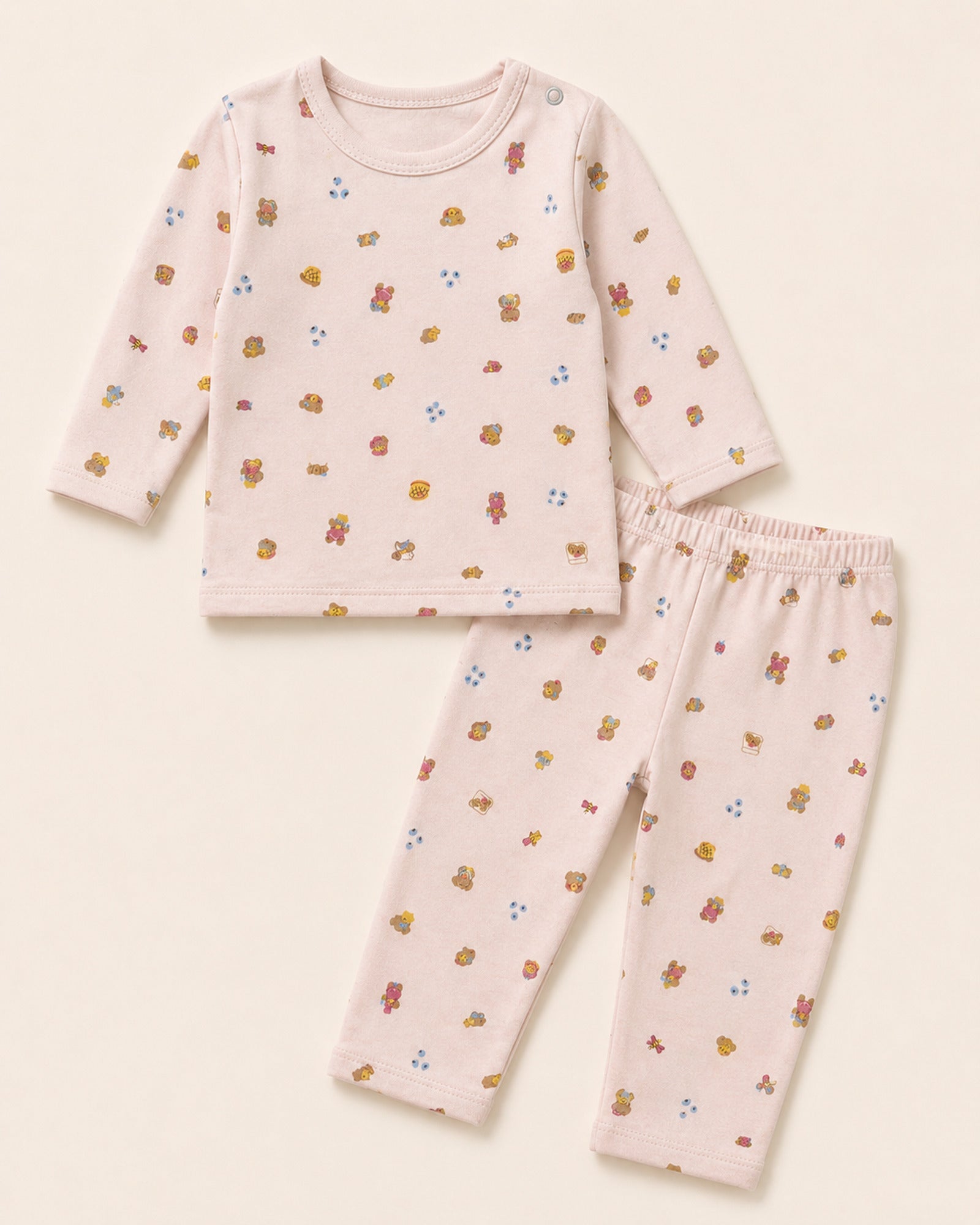 Pale pink Funny Bunny long-sleeve baby two-piece set with teddy bear treats print, full product view