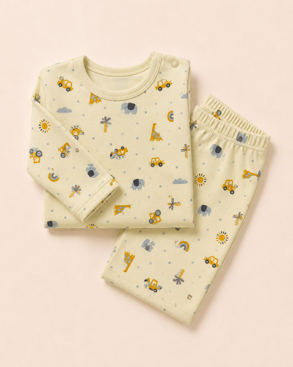 Pale buttery-yellow long-sleeve baby top and matching trousers, folded composition