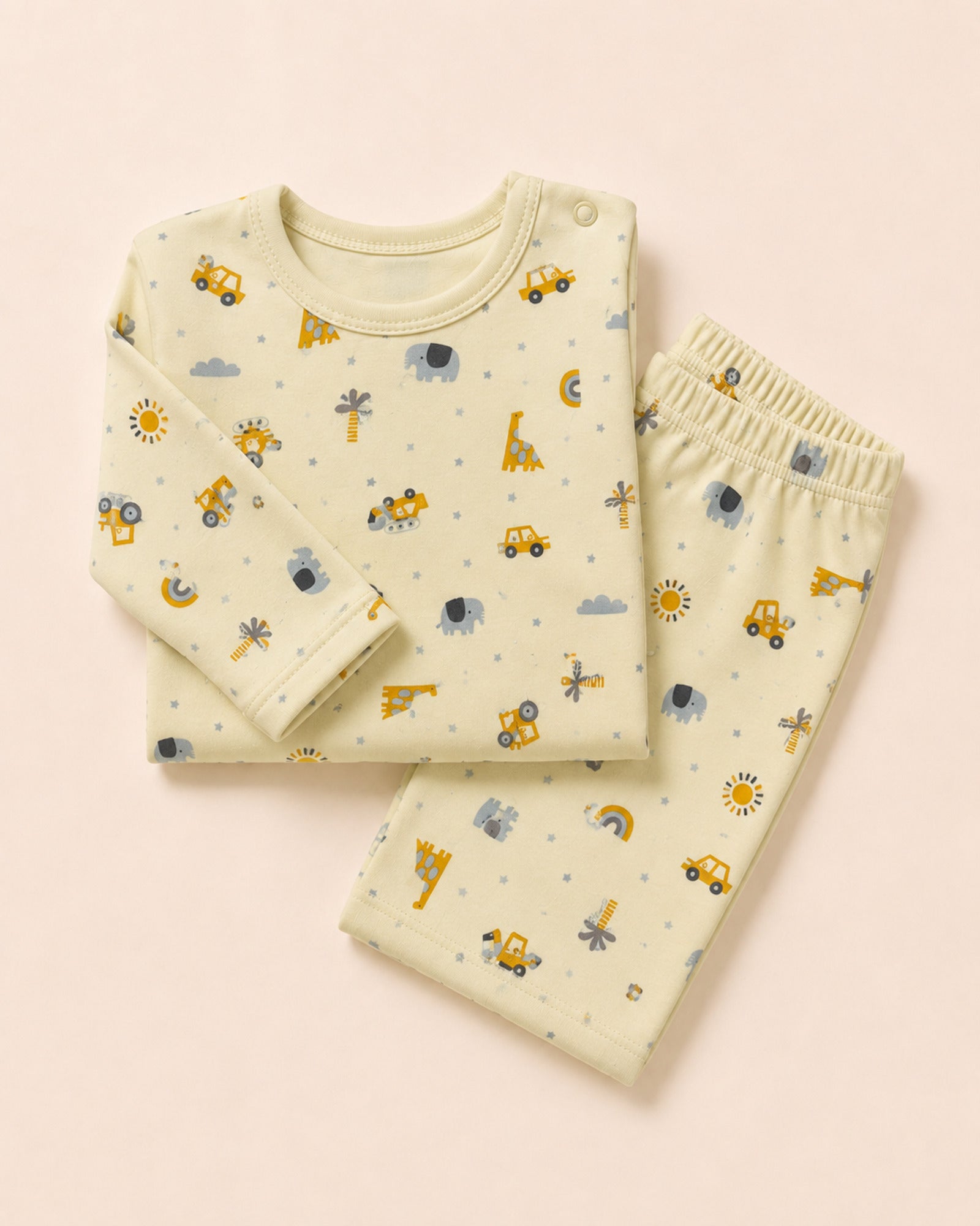 Pale buttery-yellow long-sleeve baby top and matching trousers, folded composition