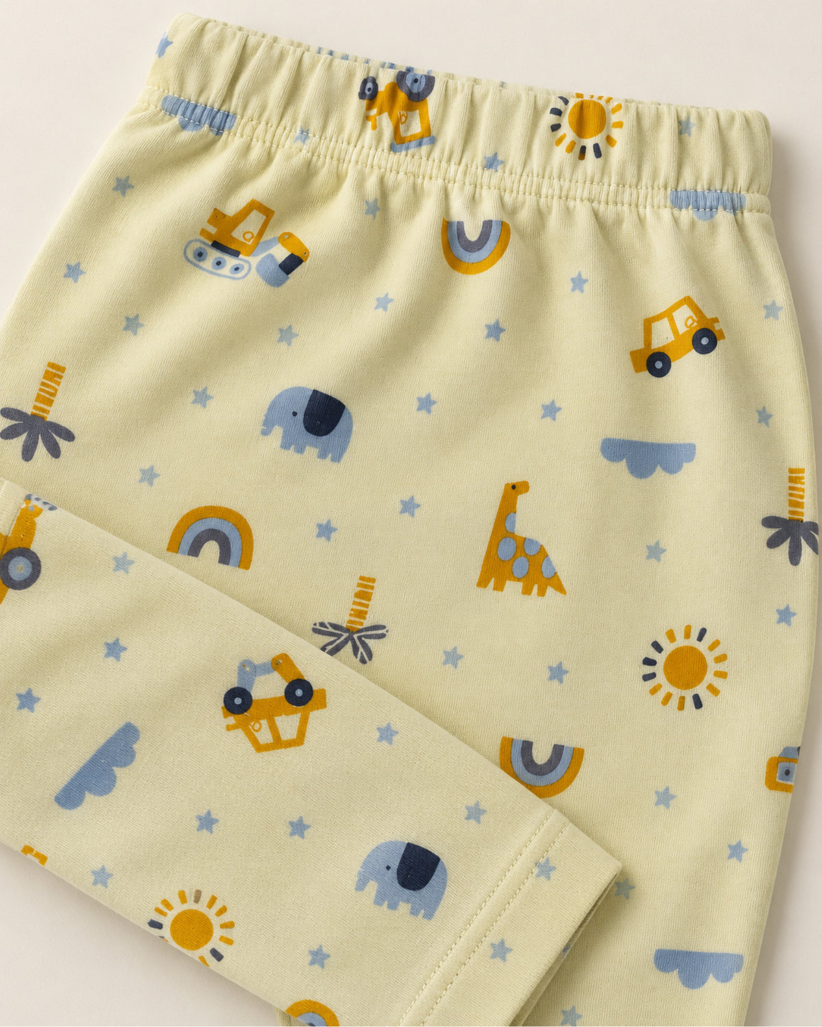 Pale yellow construction vehicles and safari print trousers elastic waistband and stitched ankle hem detail