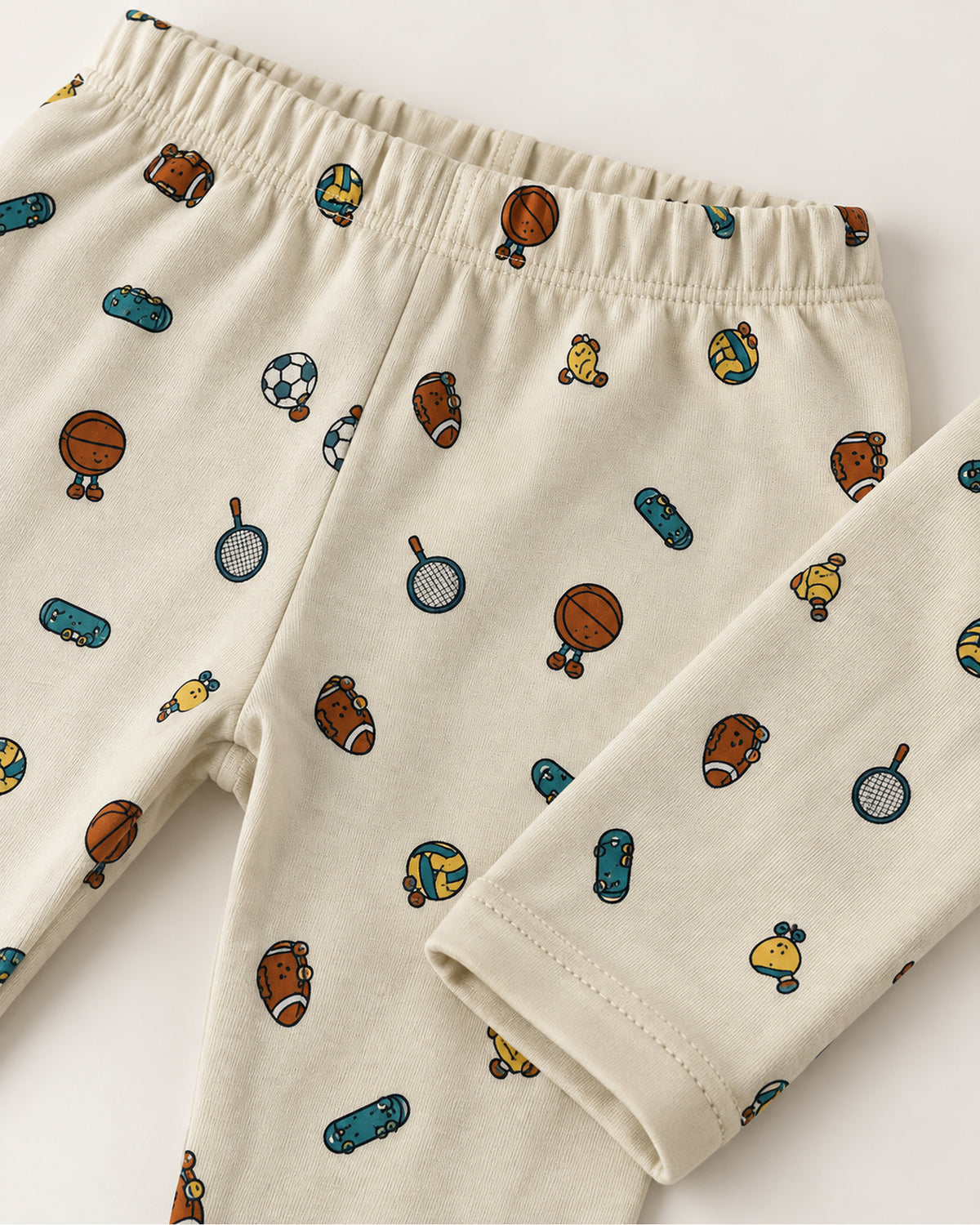 Pale cream sports print trousers elastic waistband and stitched ankle hem detail