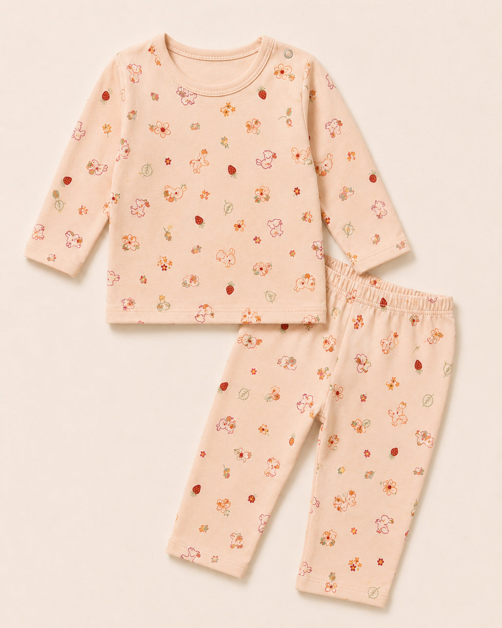 Pale peach-pink baby two-piece set with bunny, flower and strawberry print – front product view