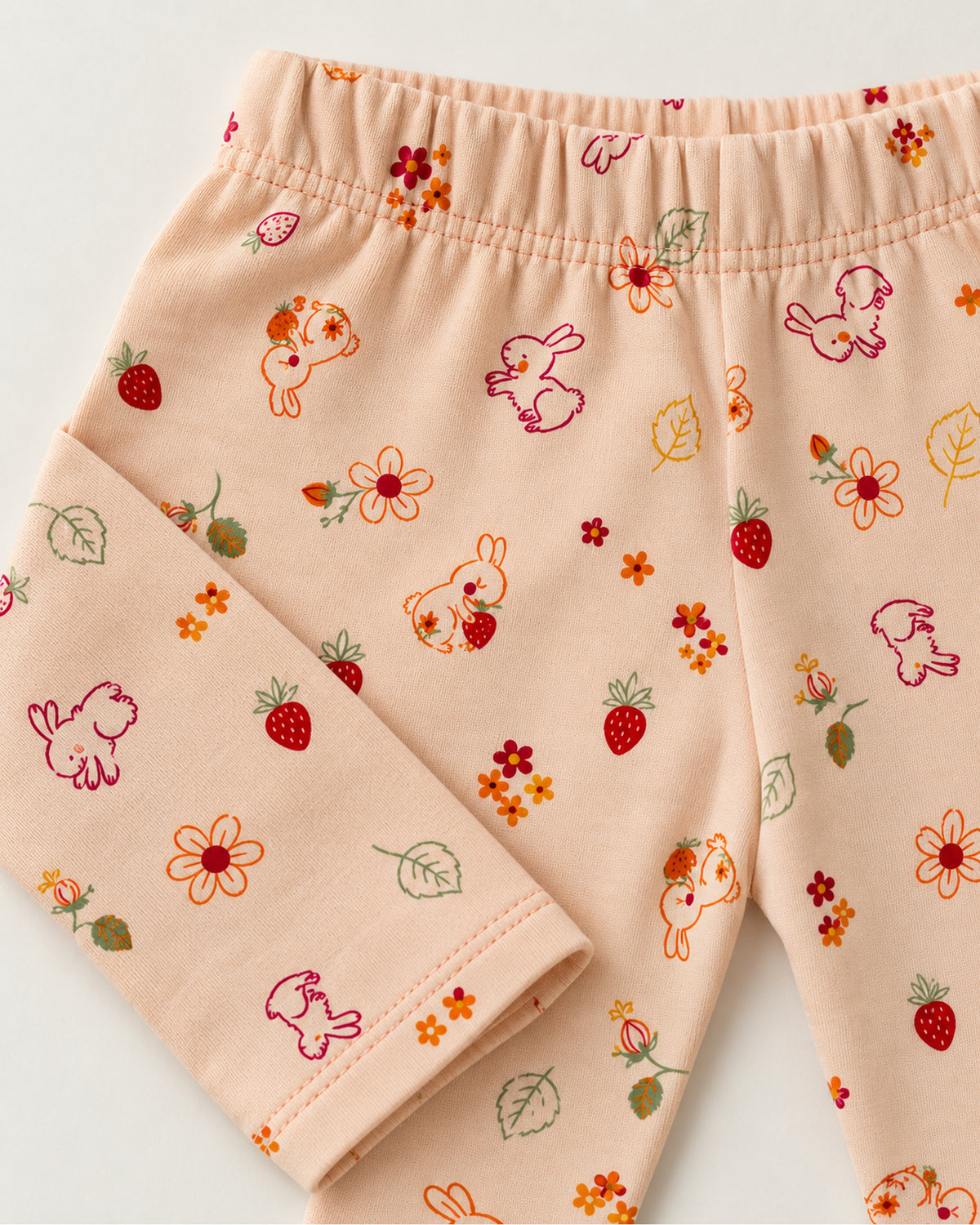 Peach pink bunny and strawberry print trousers elastic waistband and ankle hem detail