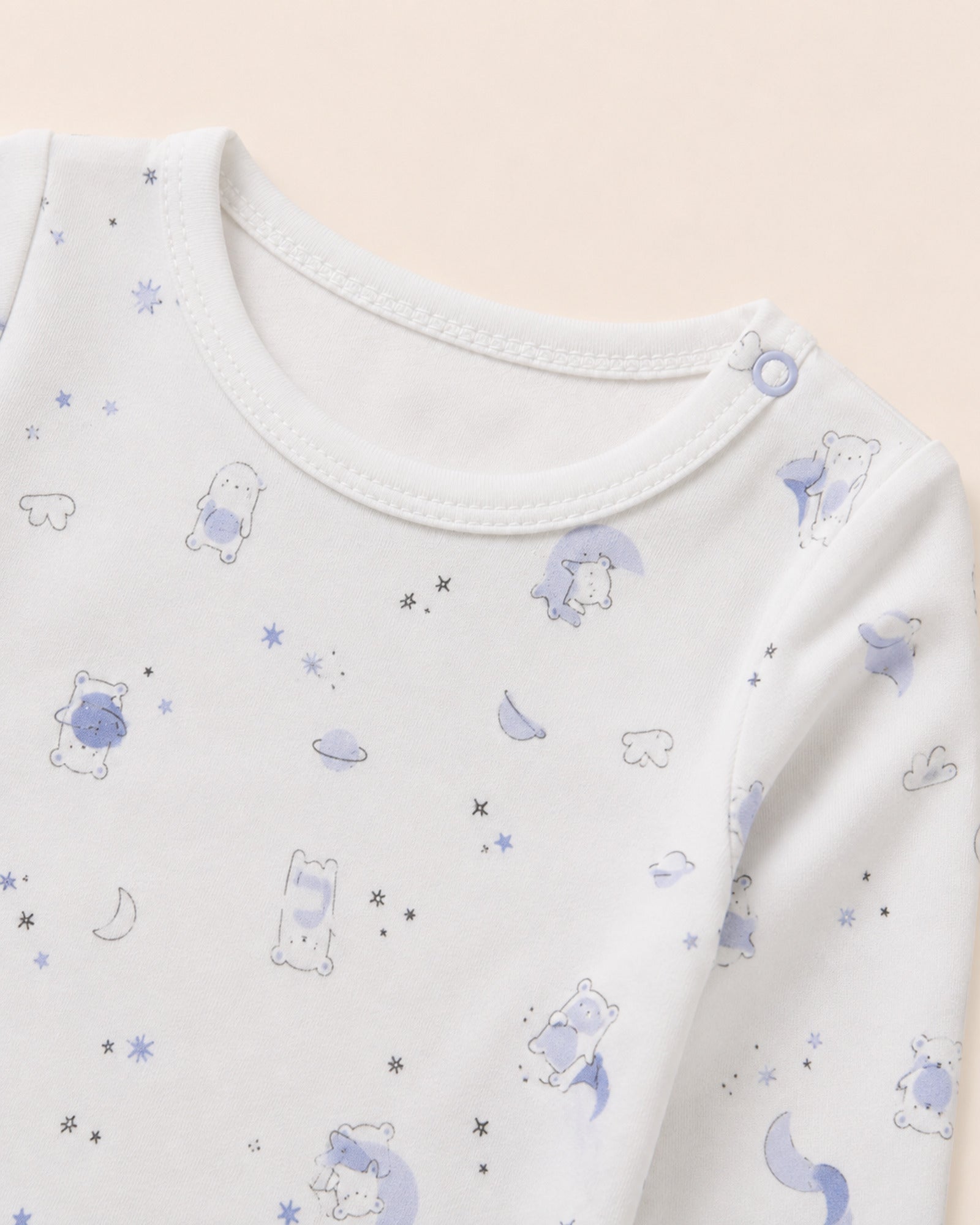White baby two-piece set – neckline, shoulder snap and teddy bear space-print detail