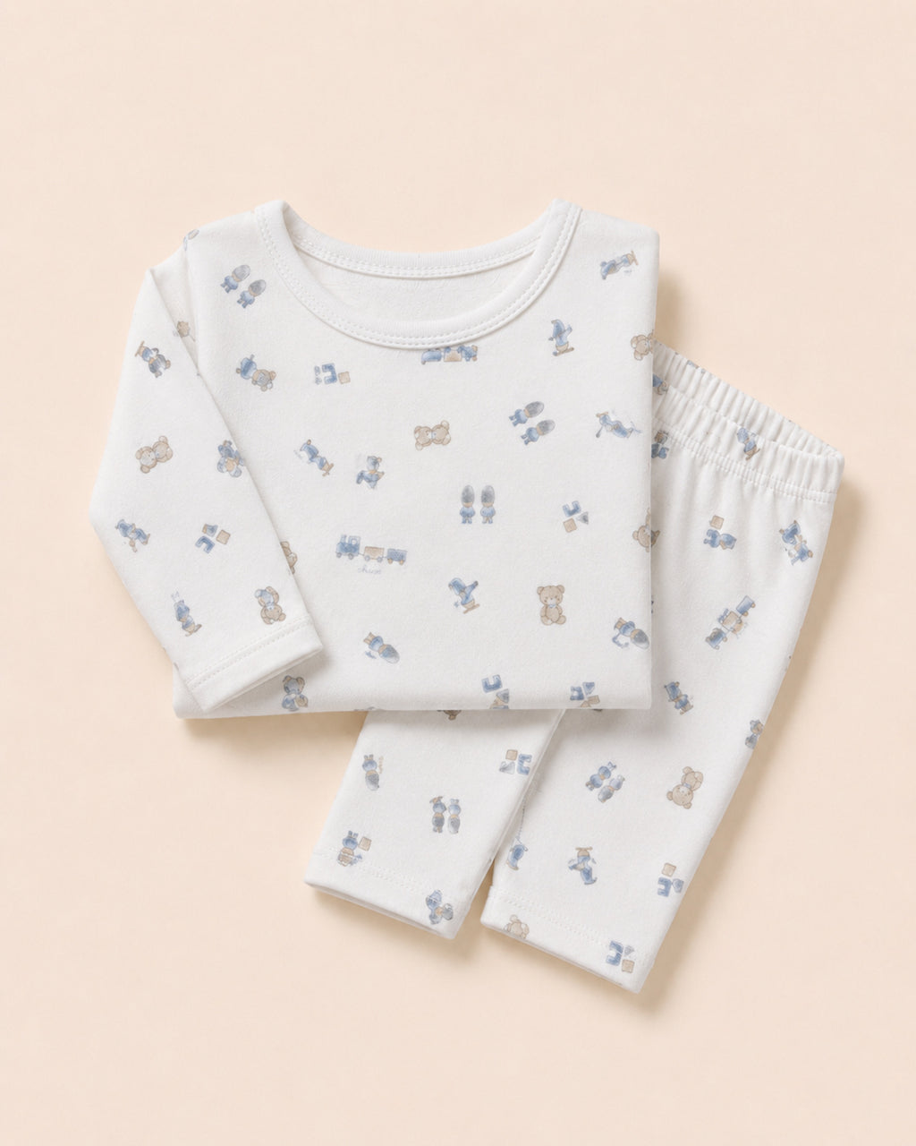 White baby two-piece set with teddy bear, train and toys print – folded composition