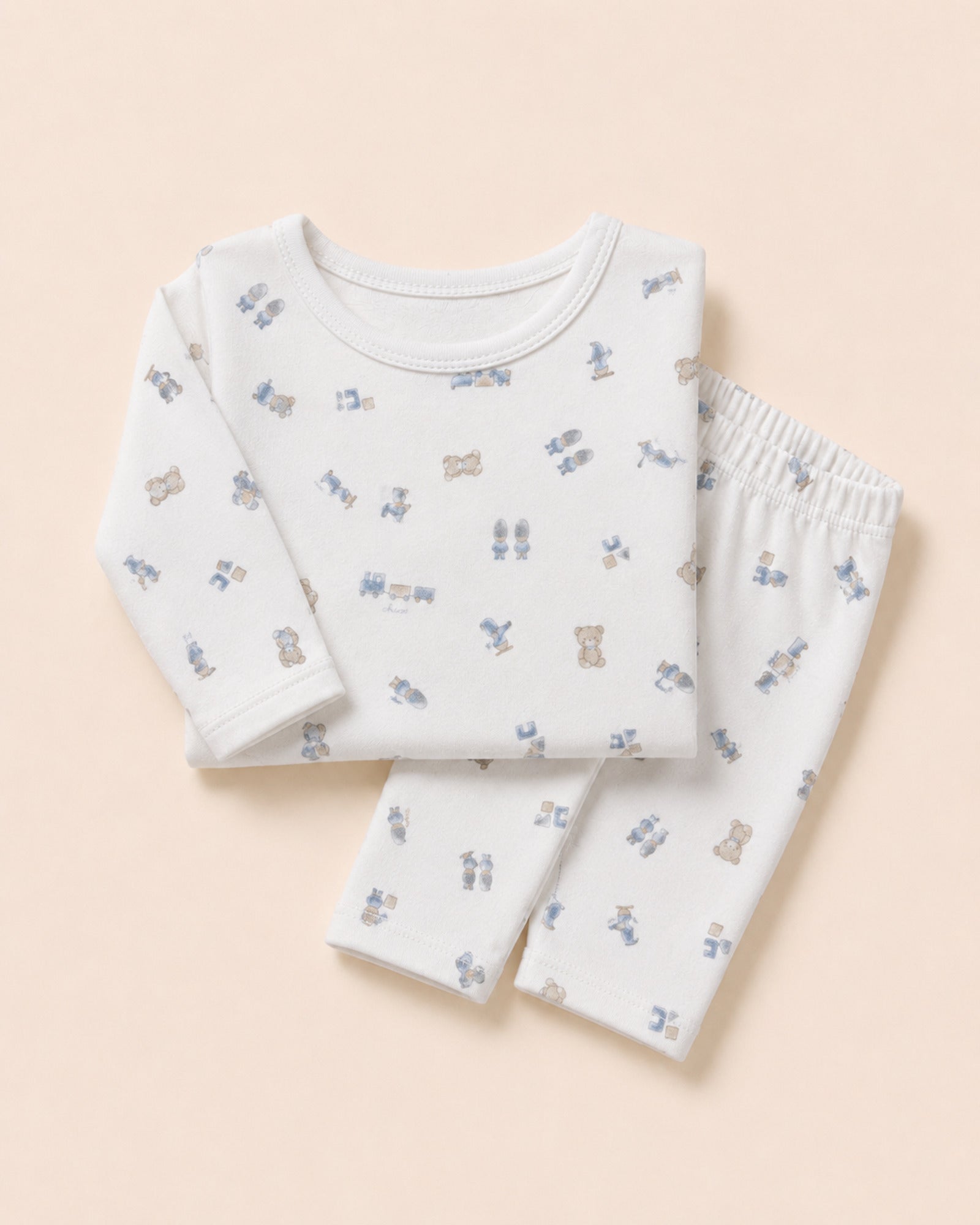 White baby two-piece set with teddy bear, train and toys print – folded composition