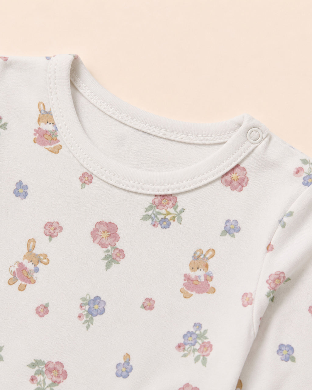 White baby two-piece set – neckline, shoulder snap and floral bunny print detail