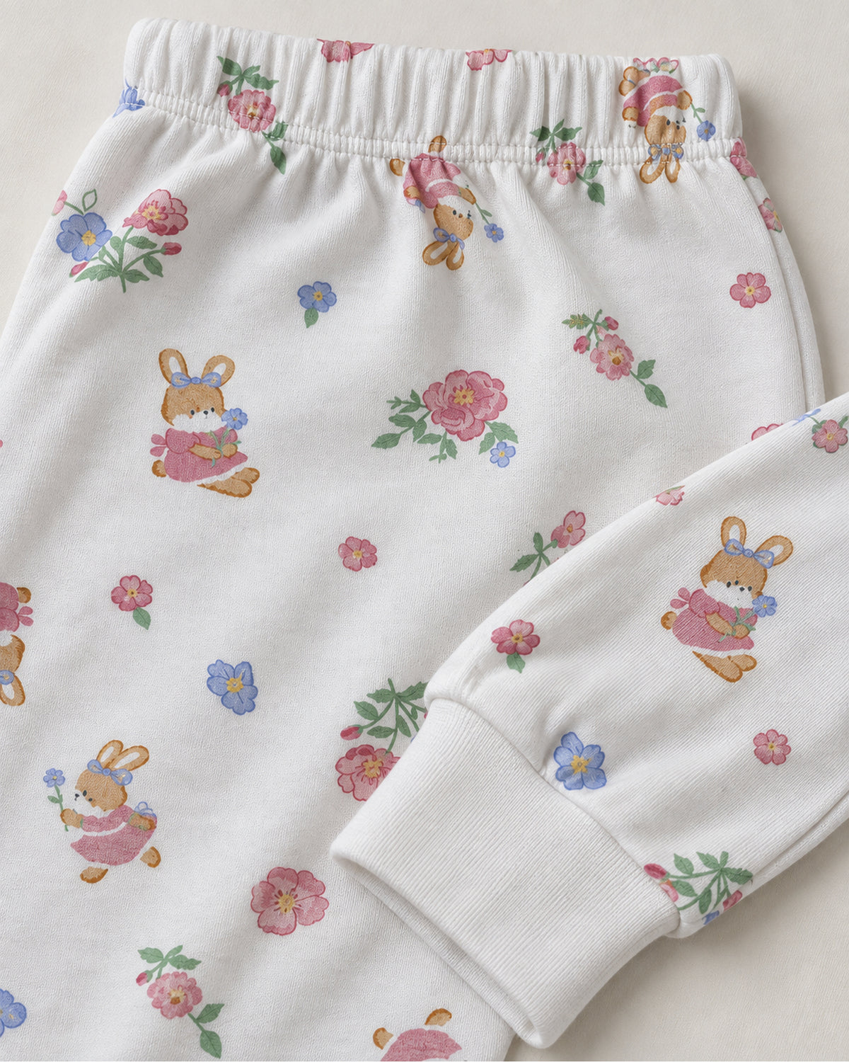 White floral bunny print trousers elastic waistband and plain white ankle cuff detail