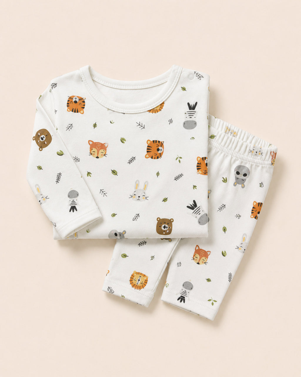 White wild-animal print baby set styled composition
