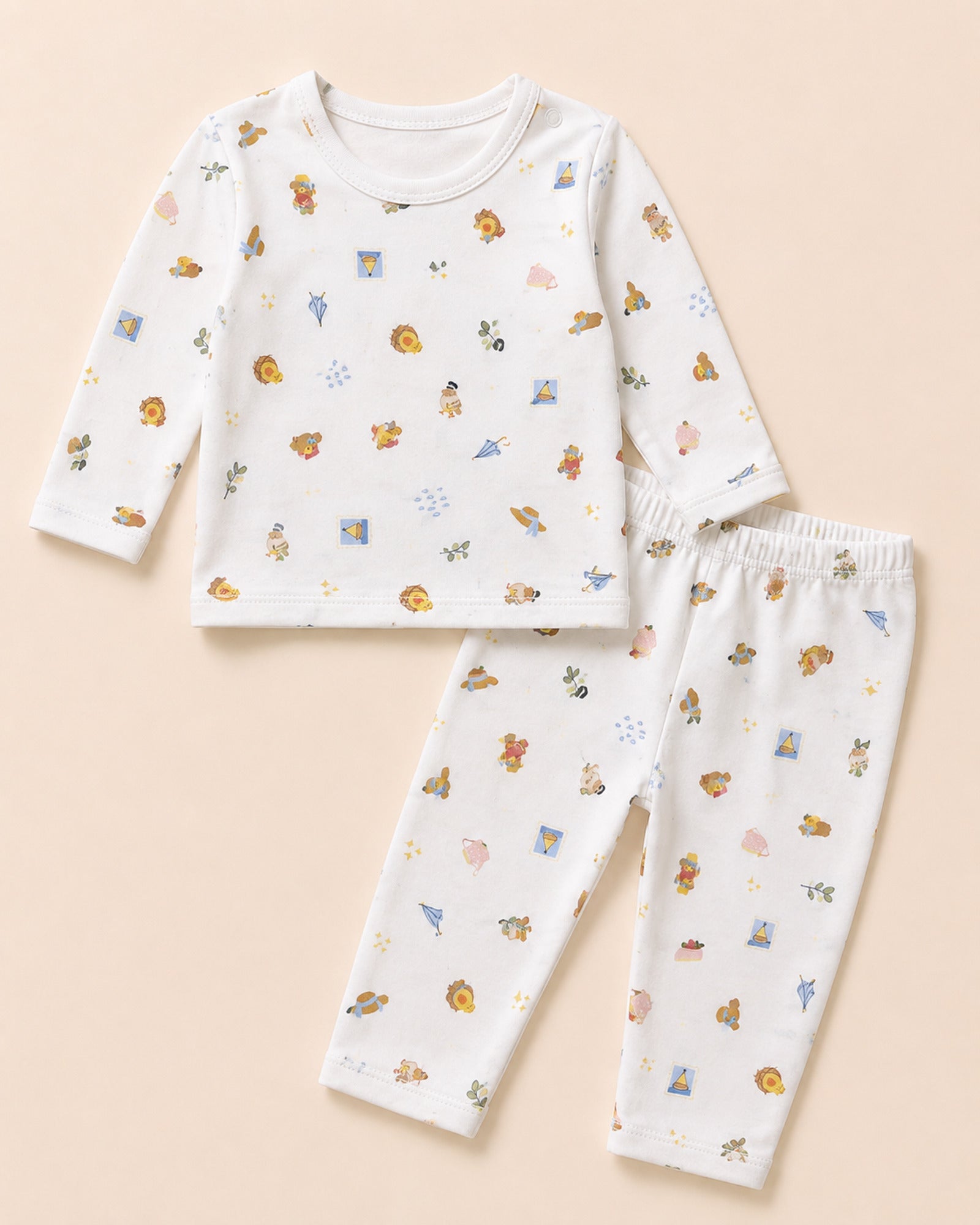 White baby two-piece set with picnic and travel icons print – front view