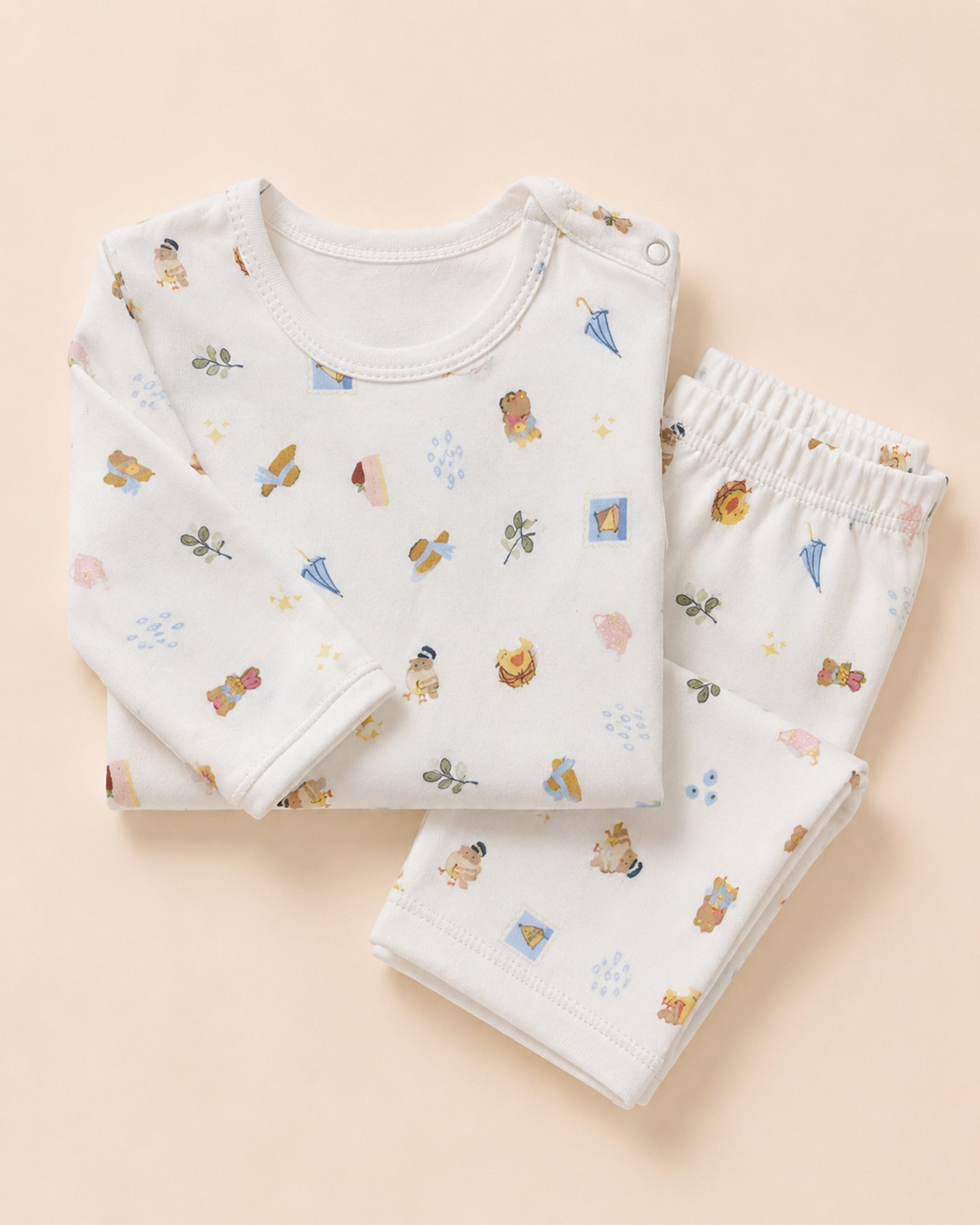 White picnic travel print baby set styled composition