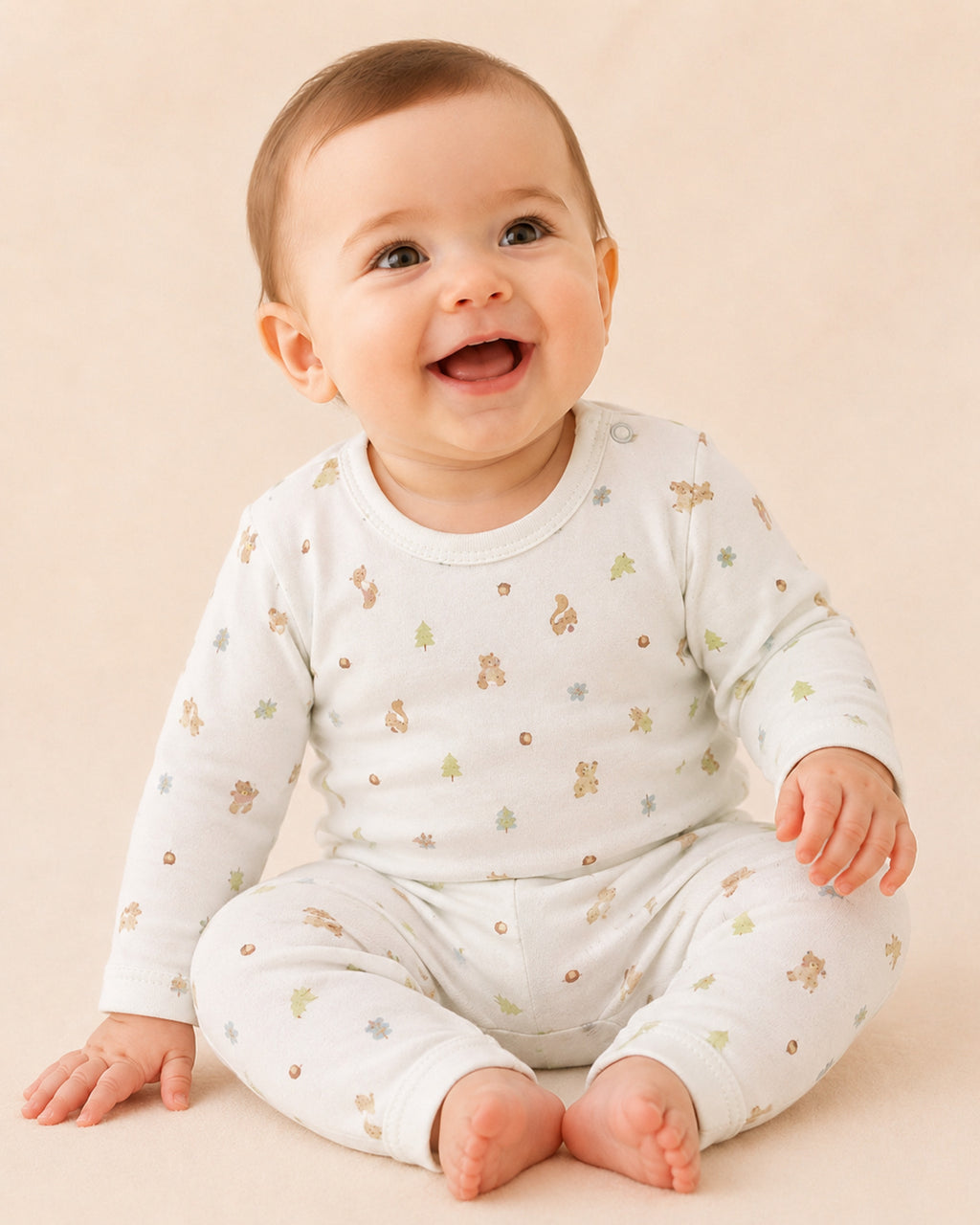Baby wearing white squirrel woodland print two-piece set
