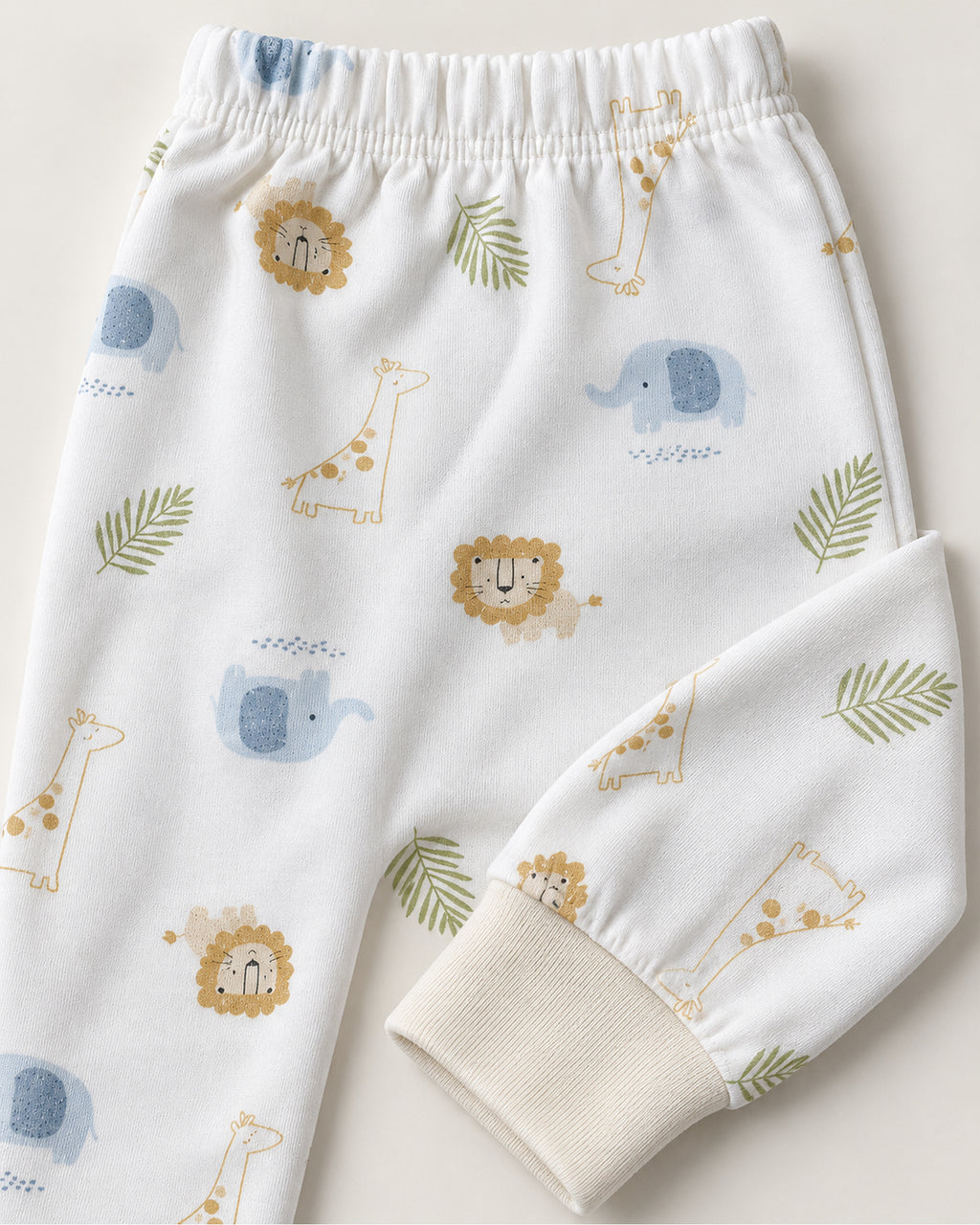 White safari animal print trousers elastic waistband and ivory ankle cuff close-up