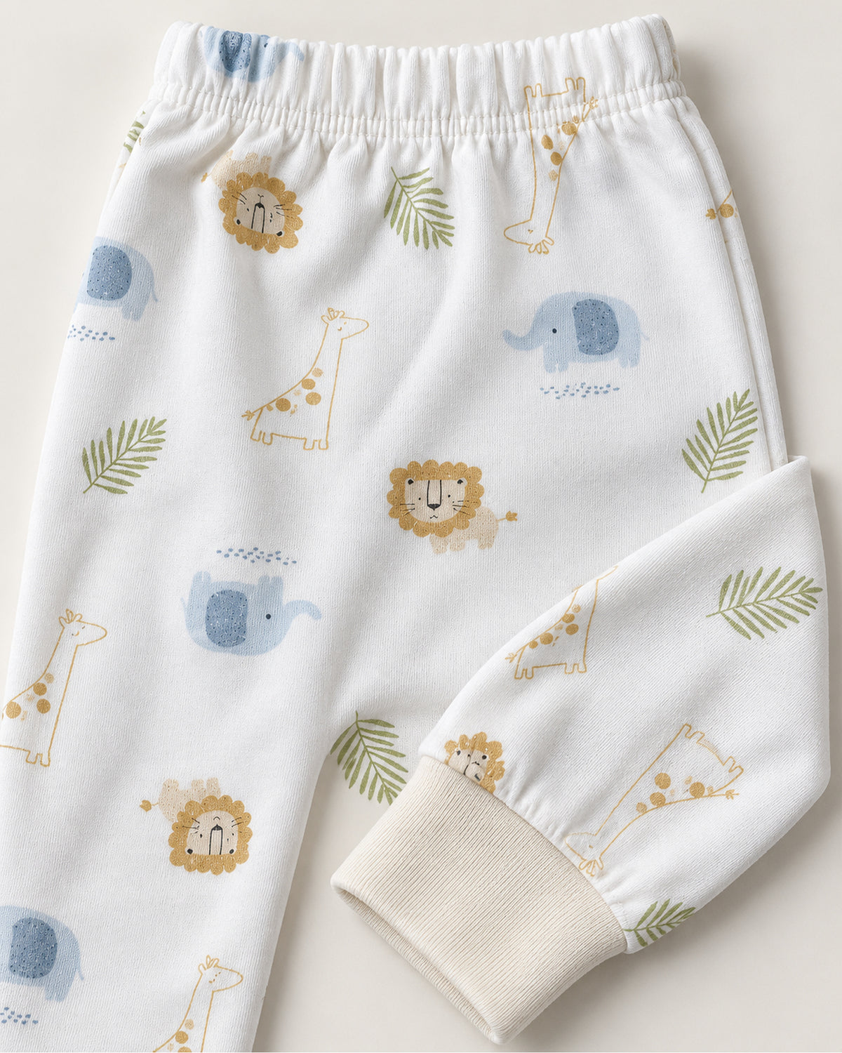 White safari animal print trousers elastic waistband and ivory ankle cuff close-up