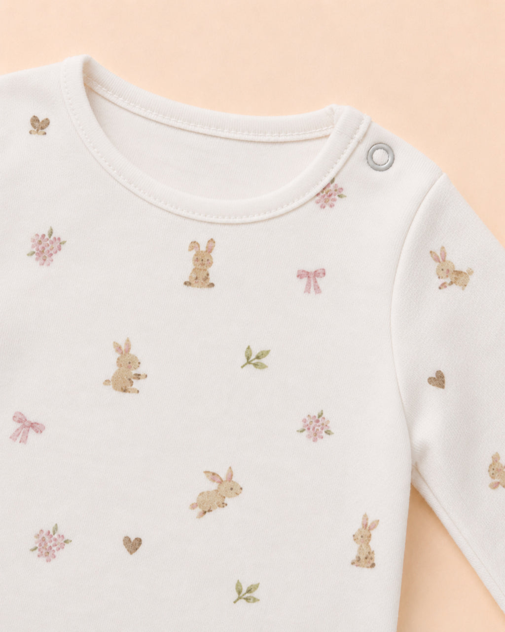 Single shoulder snap and original bunny, bow and flower print detail