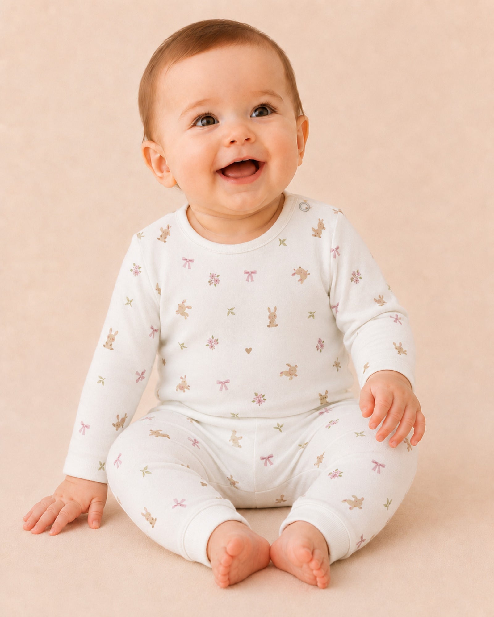 Baby wearing white bunny, bow and flower print two-piece set