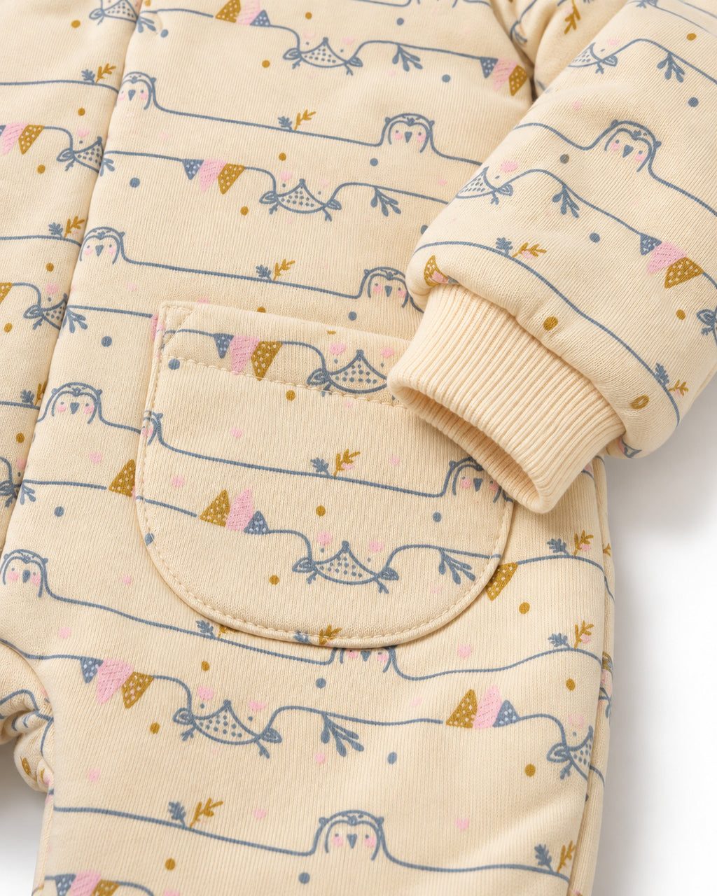Cream baby jumpsuit, front patch pocket and ribbed cuff detail