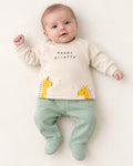 Cream and mint giraffe baby set, newborn model wearing one month footed trousers