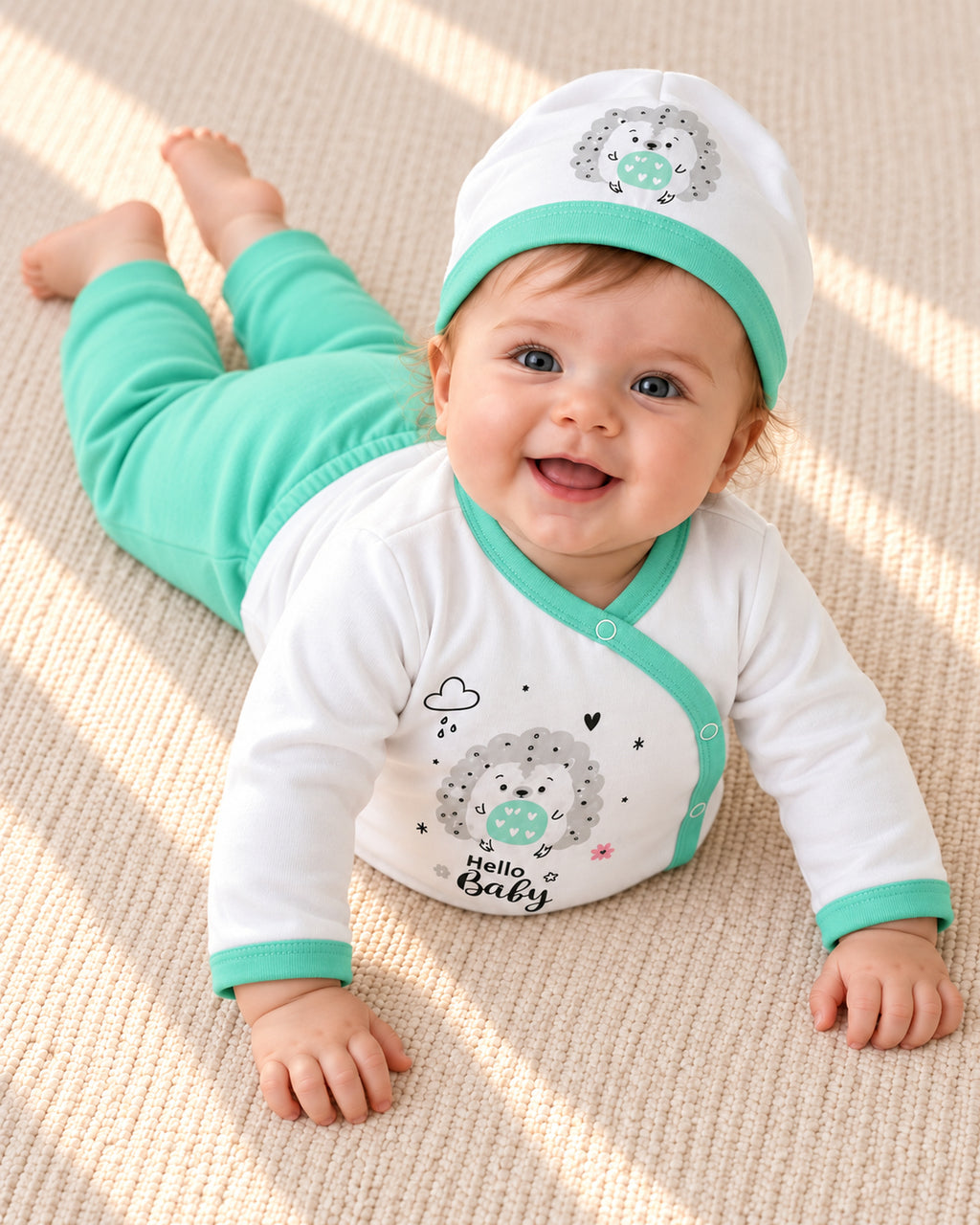Baby Dream pistachio hedgehog baby set, baby wearing the set during awake floor play