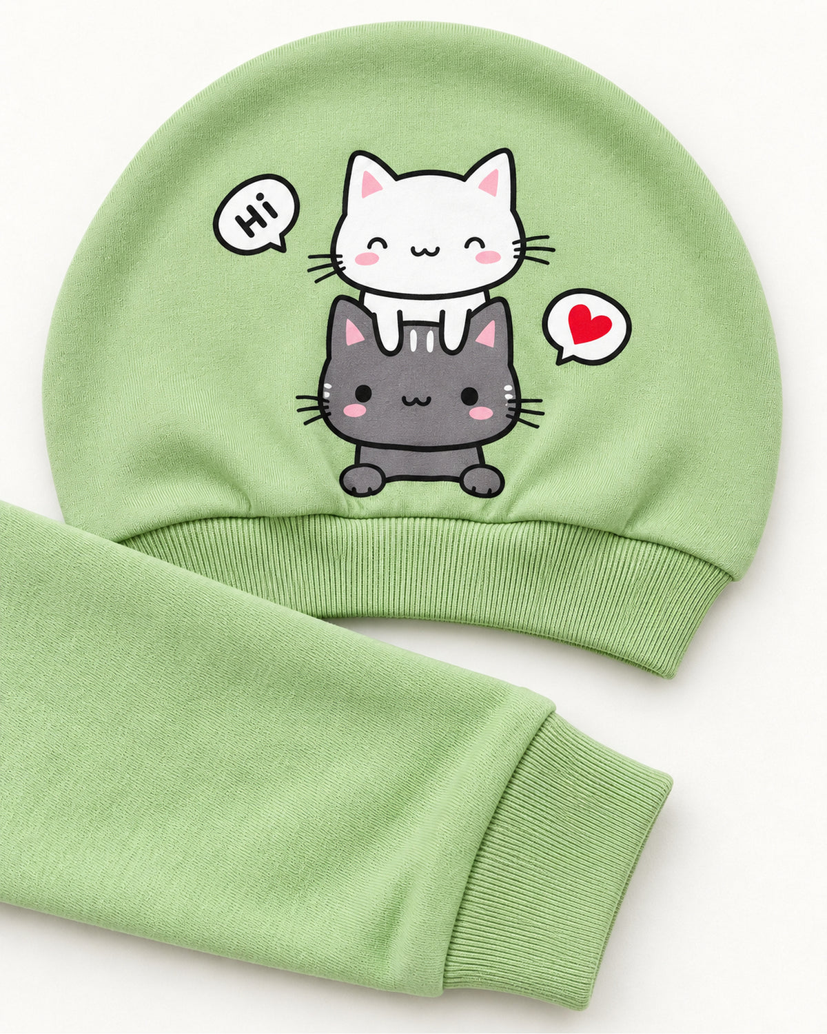 Pistachio cat sleepsuit set matching two-cat hat and sleeve cuff close-up