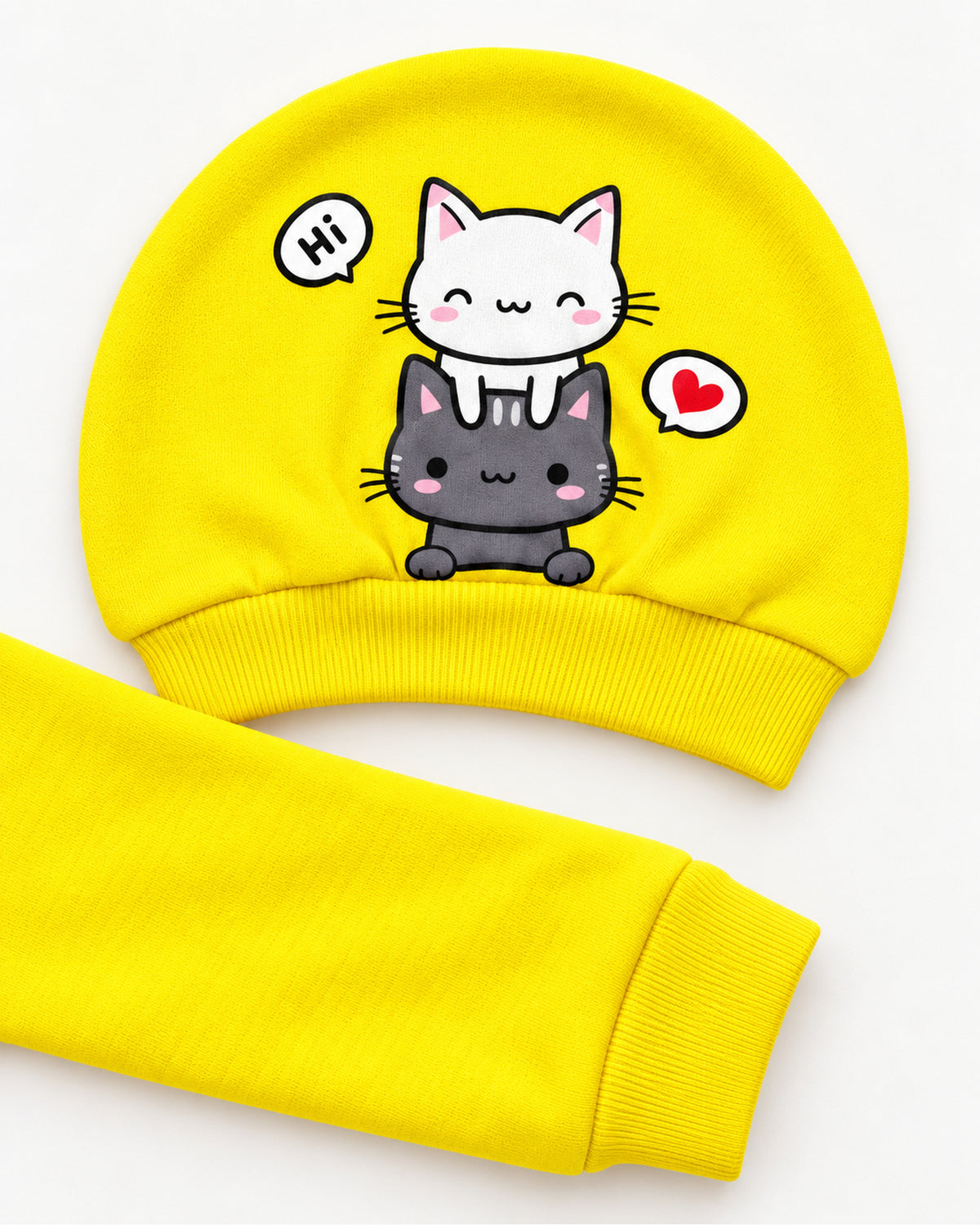 Yellow cat sleepsuit set matching two-cat hat and sleeve cuff close-up
