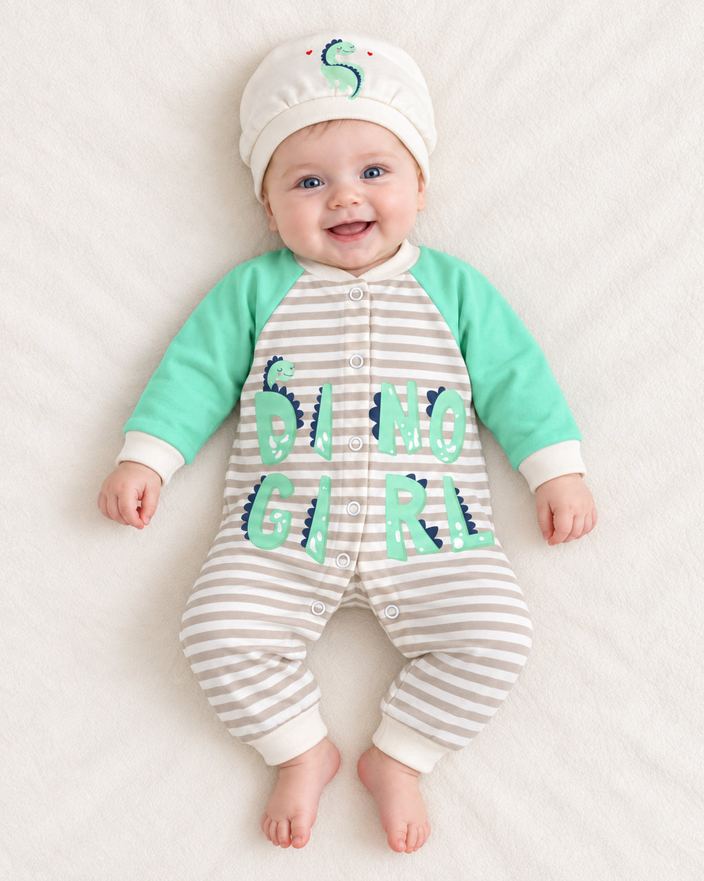 Baby Dream pistachio dinosaur sleepsuit and hat set, baby wearing the complete outfit