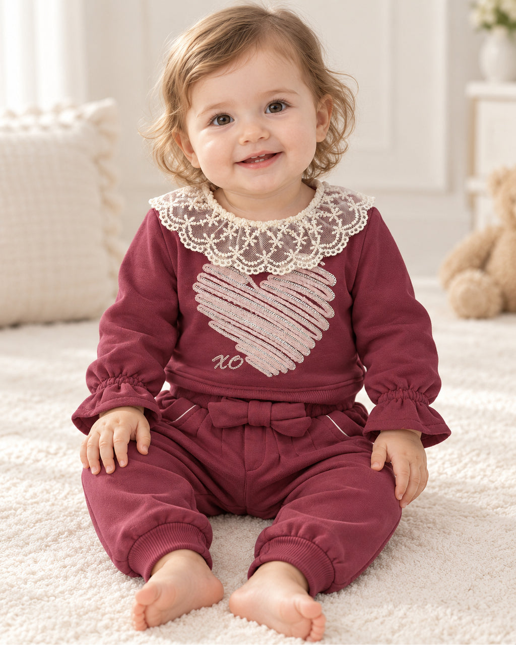 Burgundy lace-collar baby girl outfit, full outfit on a seated baby model