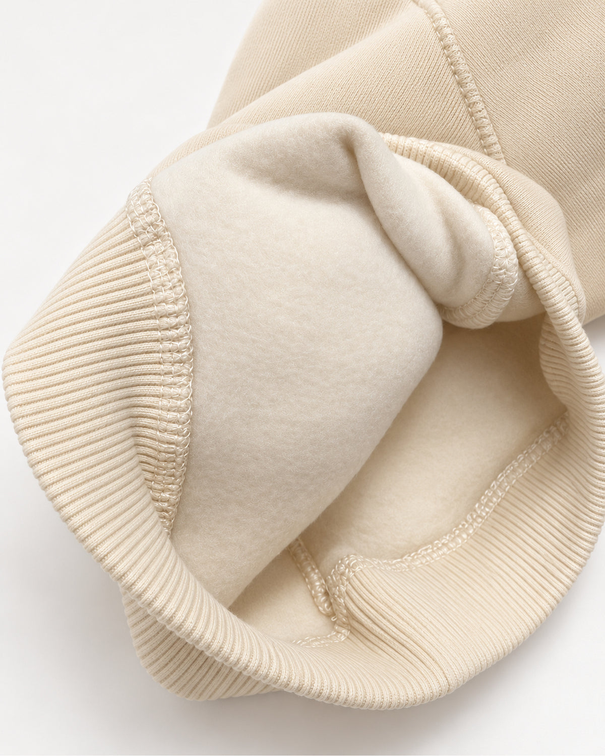Cream-beige baby I love you sweatshirt and joggers set, turned sleeve cuff showing the brushed inner surface