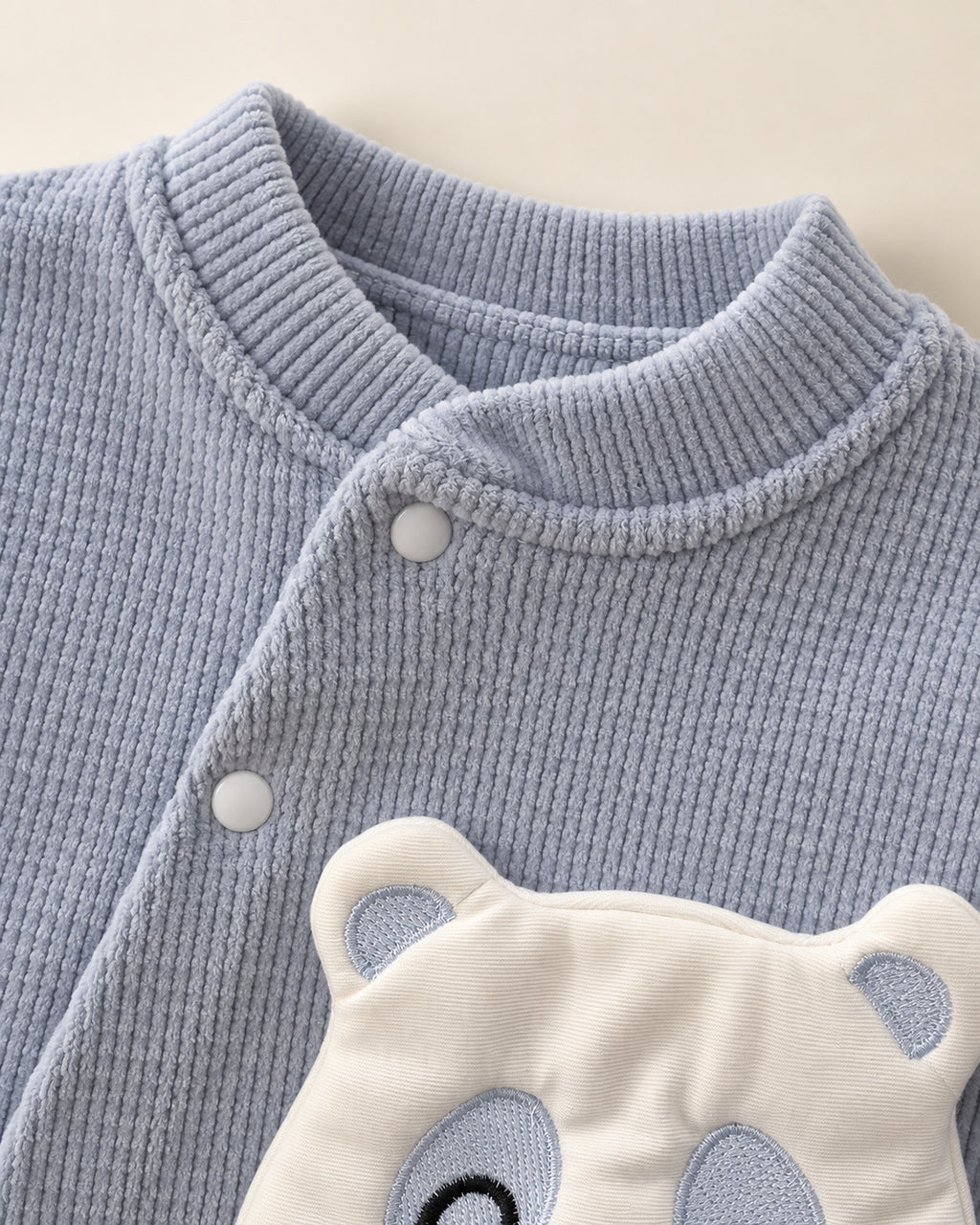 Baby Blue baby bear set, neckline and fastening detail