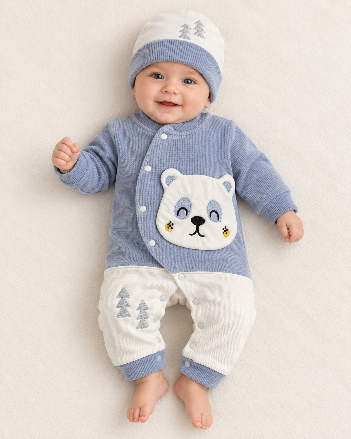 Baby Blue baby bear set, sleepsuit worn by an infant