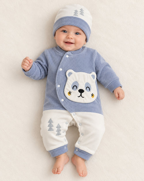 Baby Blue baby bear set, sleepsuit worn by an infant