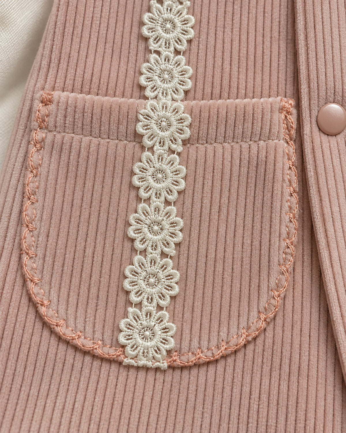 Dusty Rose baby lace collar sleepsuit, lace and pocket detail